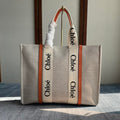 LAGRE WOODY TOTE BAG 45 IN BEIGE LINEN CANVAS BLACK WEBBING LOGO EMBROIDER ORANGE CALFSKIN