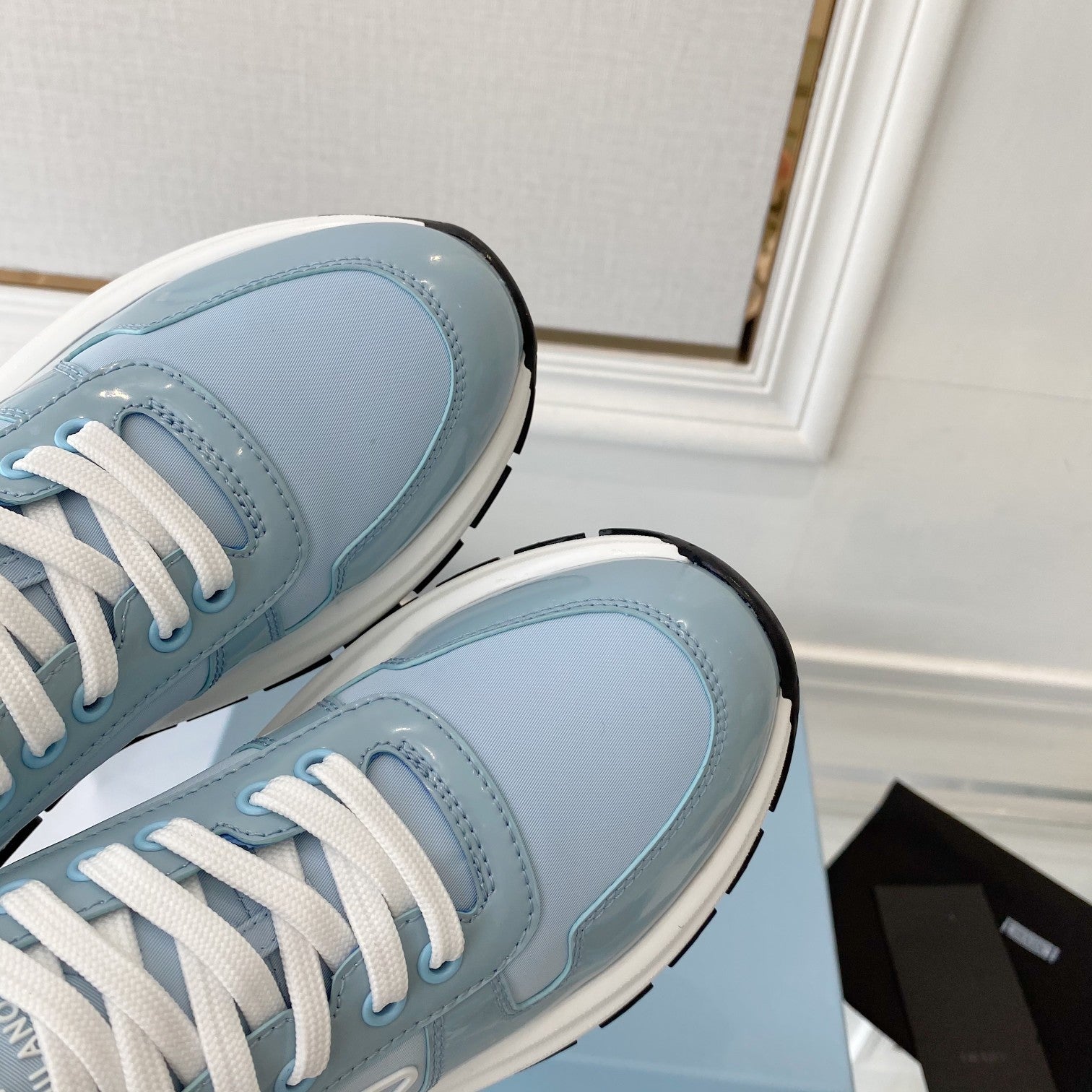 PRADA 25S THICK SOLE SNEAKER IN LIGHT BLUE CALFSKIN AND CANVAS