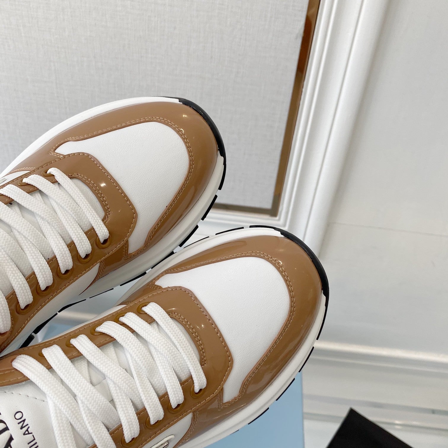 PRADA 25S THICK SOLE SNEAKER IN WHITE AND BROWN CALFSKIN