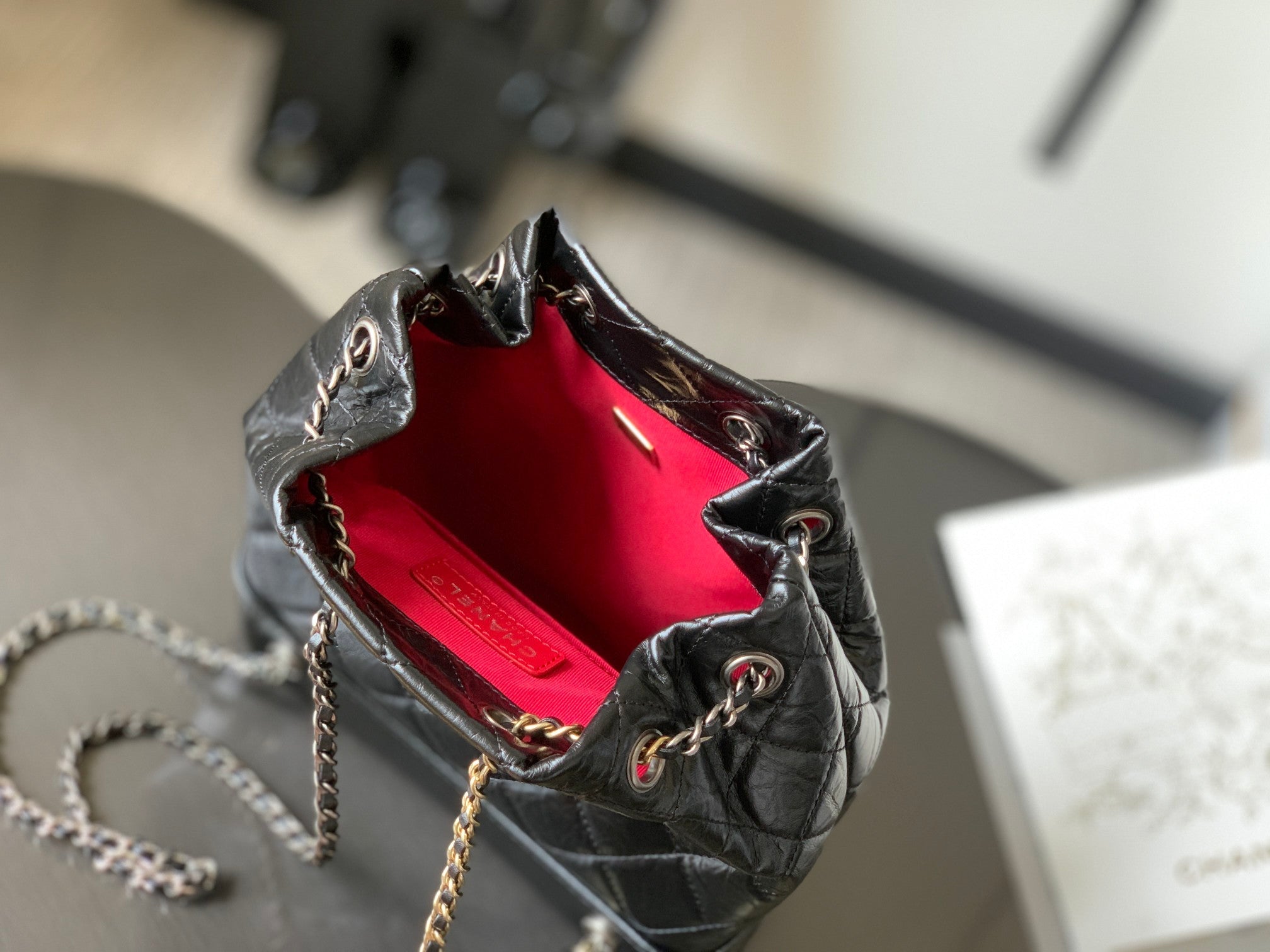 CHANEL 25S GRABRIELLE BACKPACK 24 CM IN BLACK LAMBSKIN