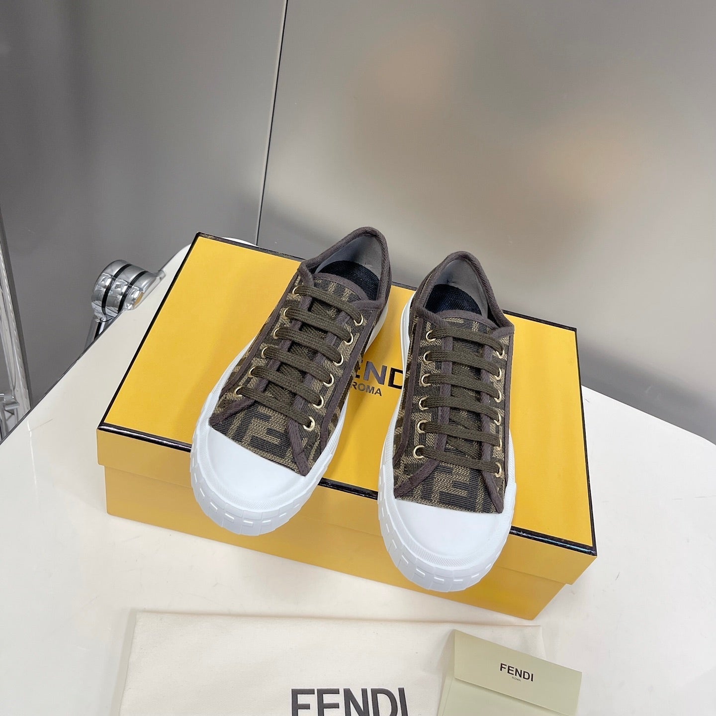 FENDI DOMINO MOTIF LOW-TOP SNEAKERS IN BROWN CANVAS