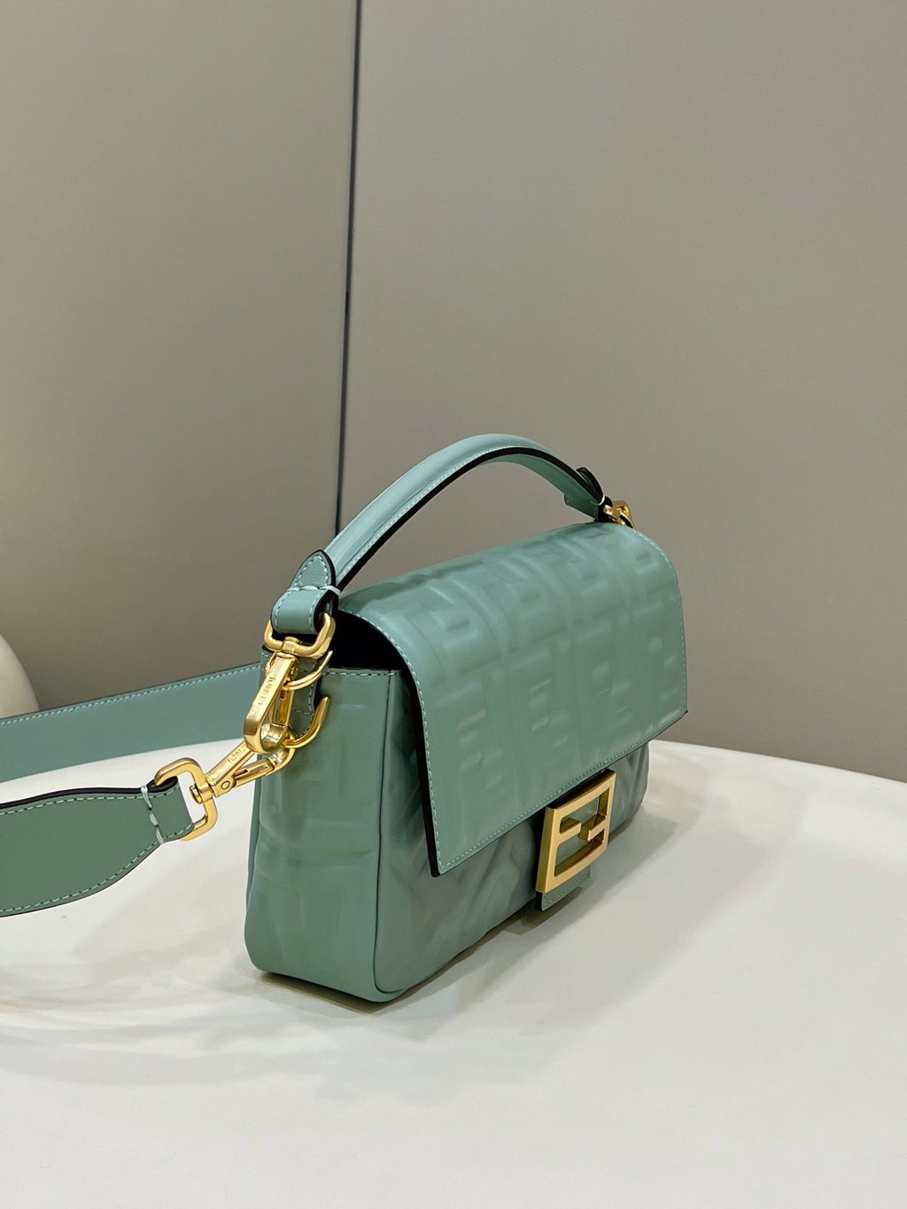 BAGUETTE WITH FF MOTIF 27 IN VIRIDIAN GREEN SOFT LAMBSKIN GOLD HARDWARE