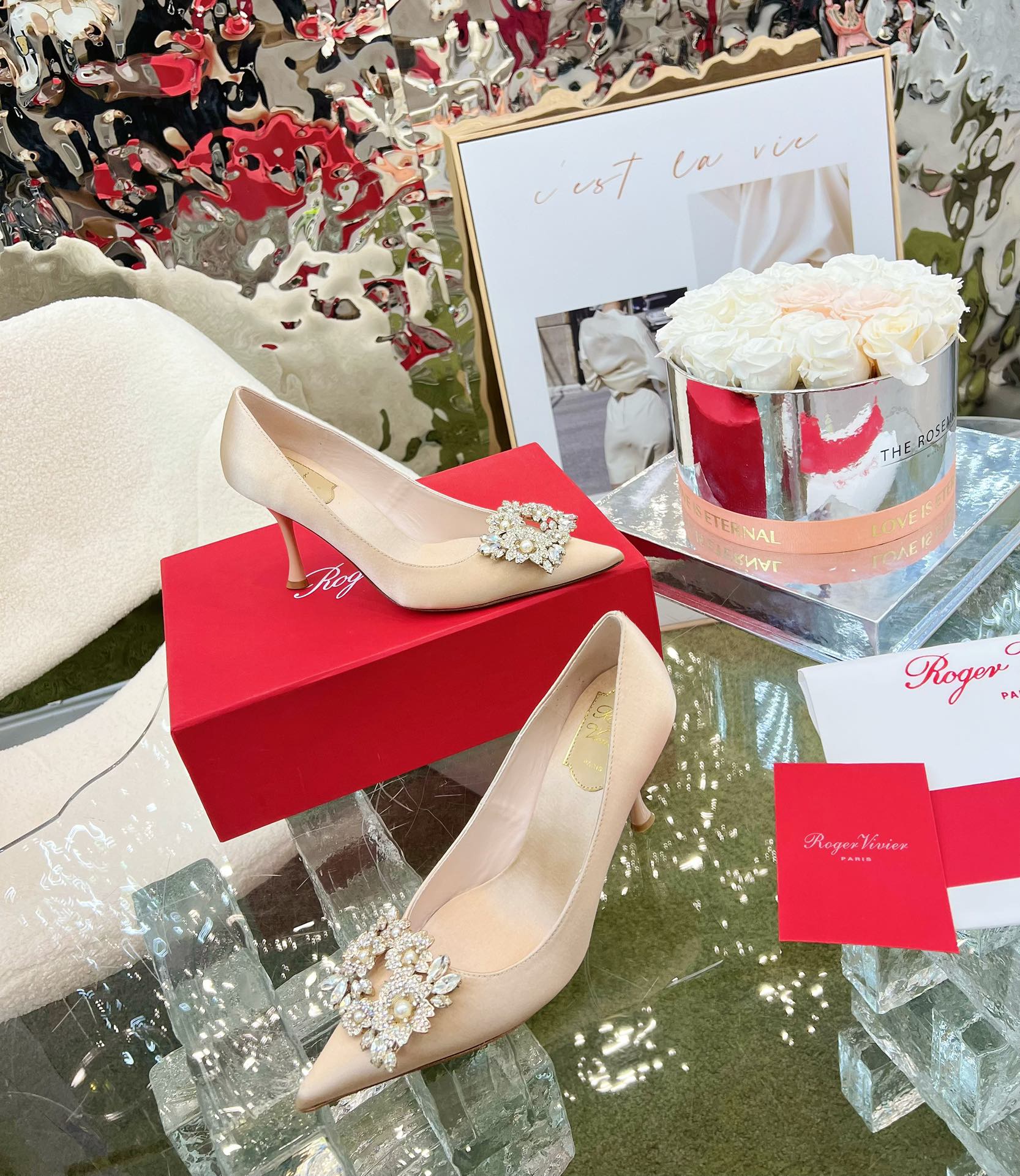 EFFLORESCENCE POINTED-TOE PUMPS IN NUDE SATIN WITH CRYSTAL BUCKLE