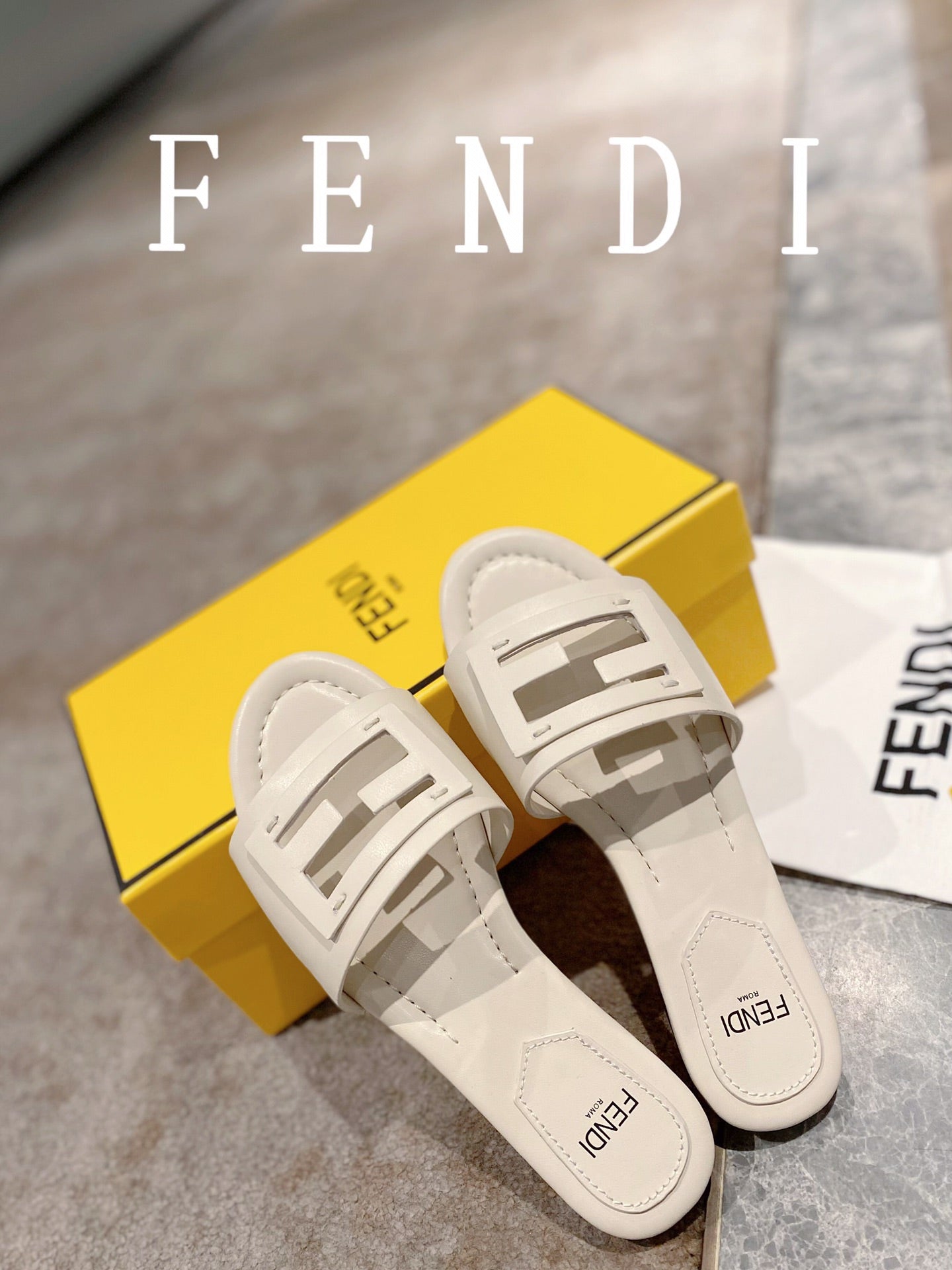 FENDI BAGUETTE SLIDES IN WHITE LAMBSKIN