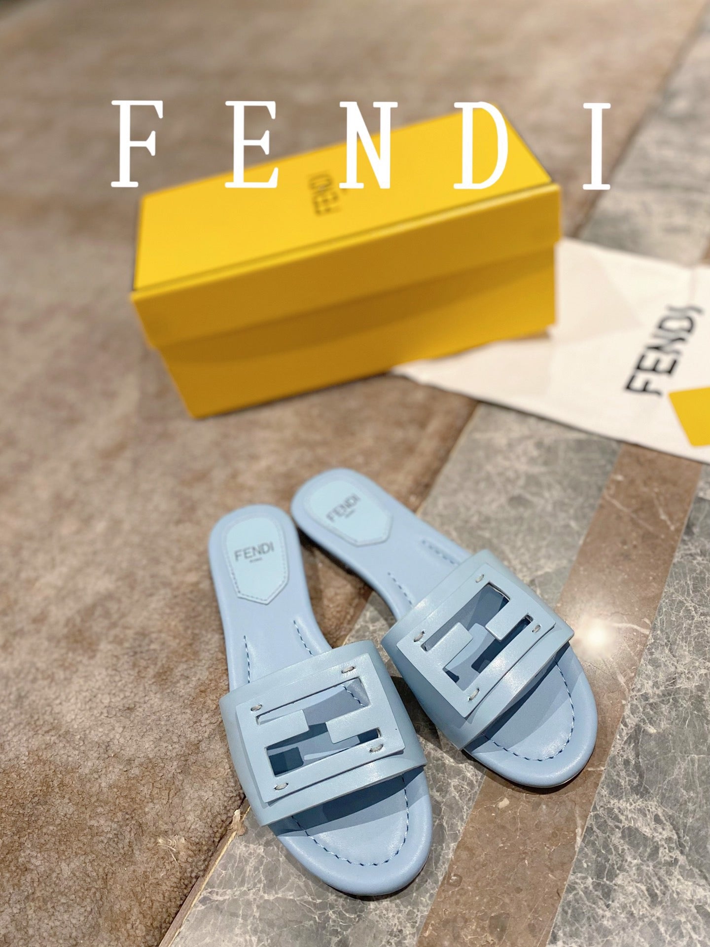 FENDI BAGUETTE SLIDES IN  BABY BLUE LAMBSKIN