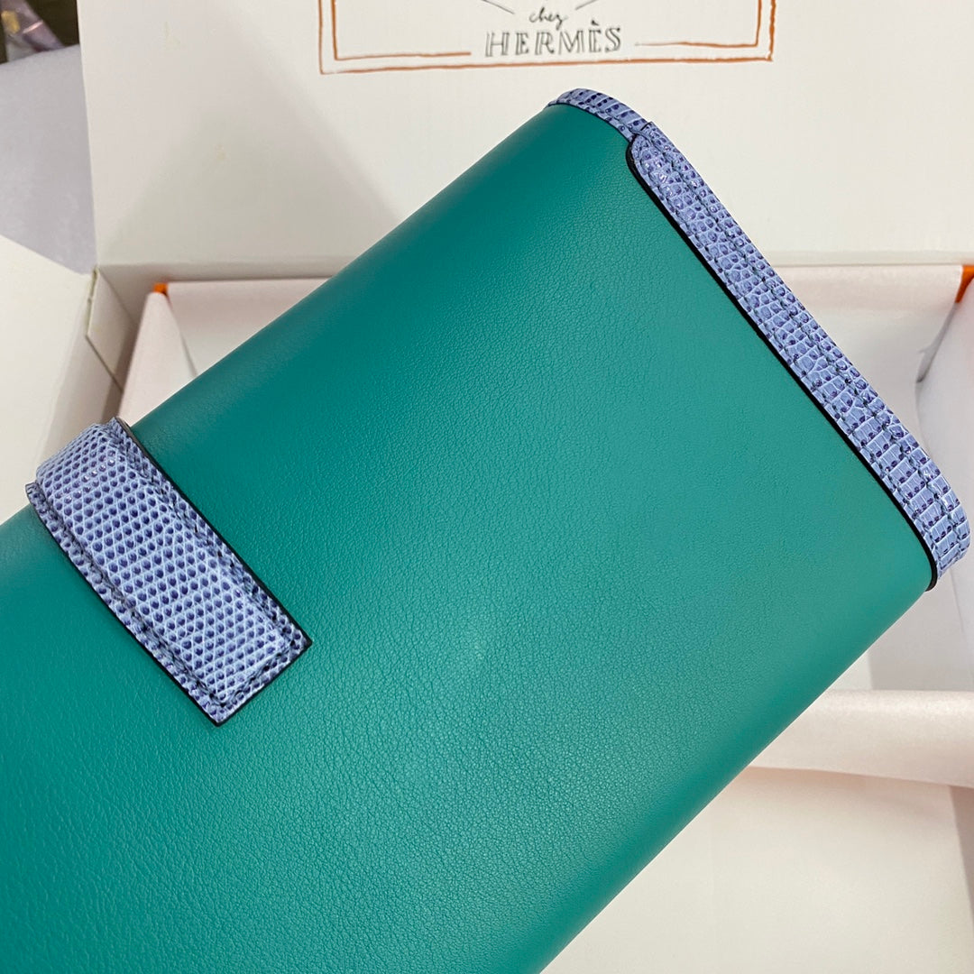 JIGE ELAN 29 CLUTCH IN TEAL GREEN CALFSKIN WITH ROYAL BLUE LIZARD SKIN