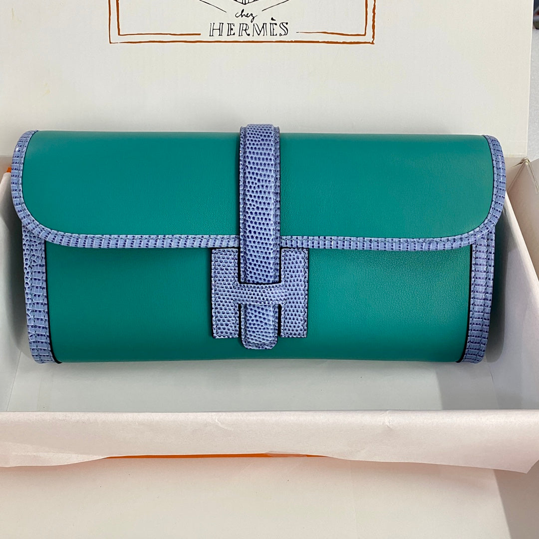 JIGE ELAN 29 CLUTCH IN TEAL GREEN CALFSKIN WITH ROYAL BLUE LIZARD SKIN