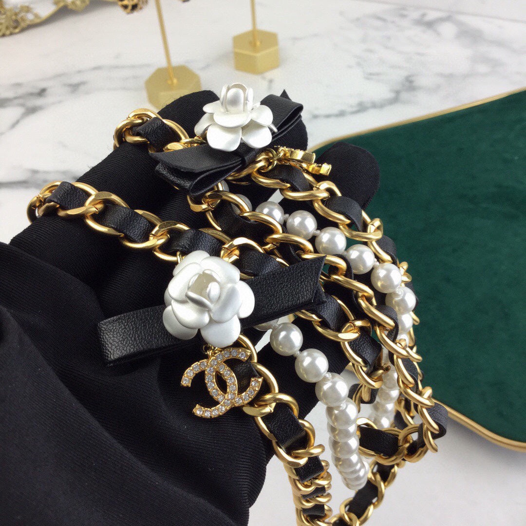 CHANEL 25S CHAIN BELT IN WHITE PEARL AND BLACK CALFSKIN 614403