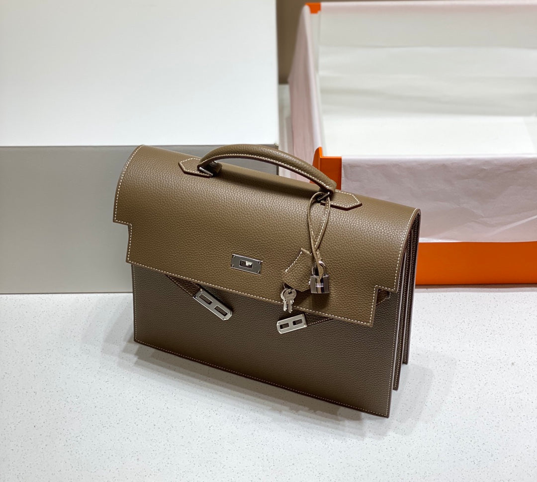 KELLY DEPECHES 34 BRIEFCASE IN ETOUPE TOGO CALFSKIN SILVER HARDWARE