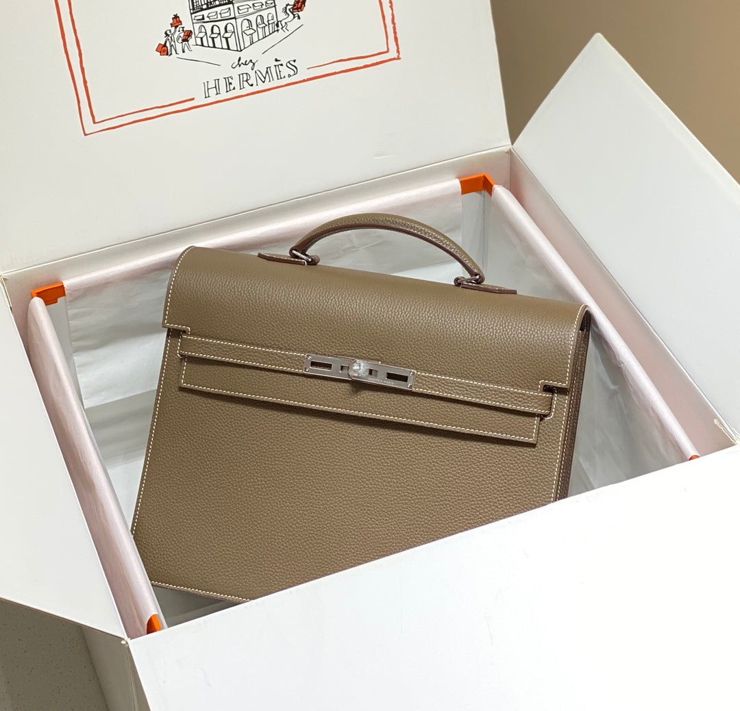 KELLY DEPECHES 34 BRIEFCASE IN ETOUPE TOGO CALFSKIN SILVER HARDWARE