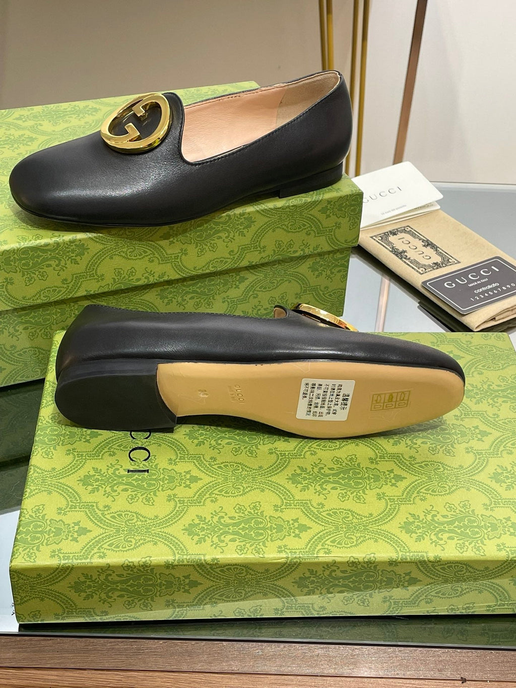 BLONDIE LOGO-PLAQUE LOAFERS IN BLACK CALFSKIN WITH GOLD HARDWARE