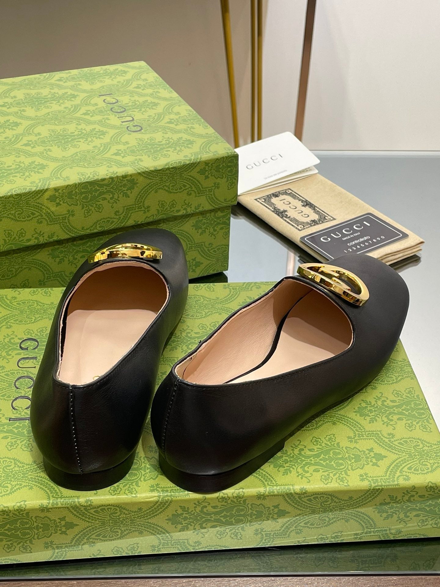 BLONDIE LOGO-PLAQUE LOAFERS IN BLACK CALFSKIN WITH GOLD HARDWARE