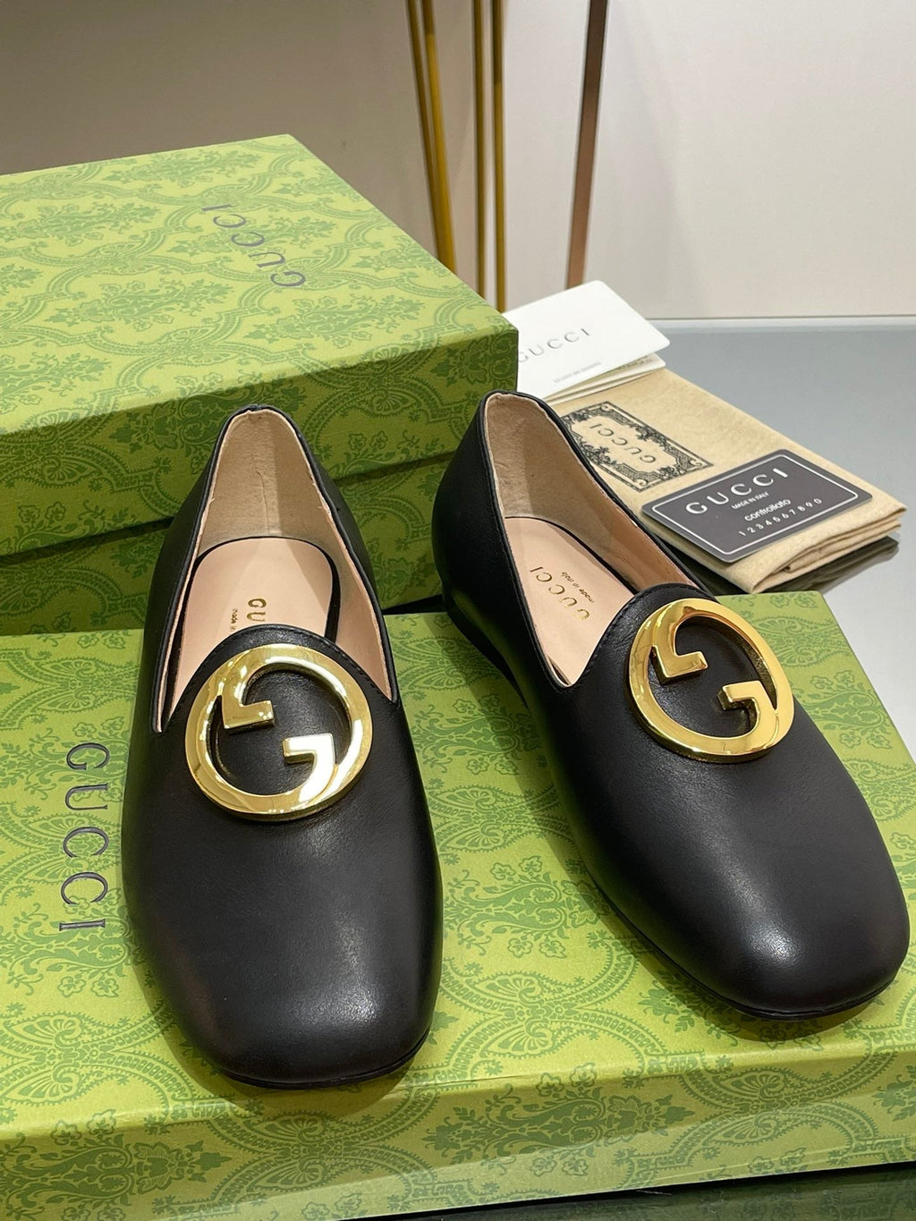 BLONDIE LOGO-PLAQUE LOAFERS IN BLACK CALFSKIN WITH GOLD HARDWARE