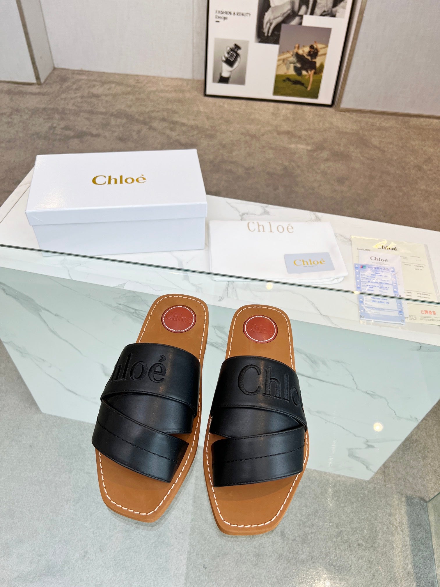 CHLOÉ WOODY MULE IN BLACK LAMBSKIN WITH EMBROIDERED LOGO