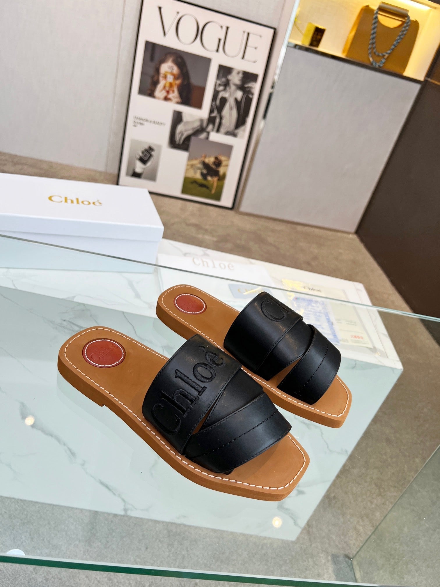 WOODY MULE IN BLACK LAMBSKIN WITH EMBROIDERED LOGO