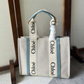 LAGRE WOODY TOTE BAG 45 IN BEIGE LINEN CANVAS BLACK WEBBING LOGO EMBROIDER BLUE CALFSKIN