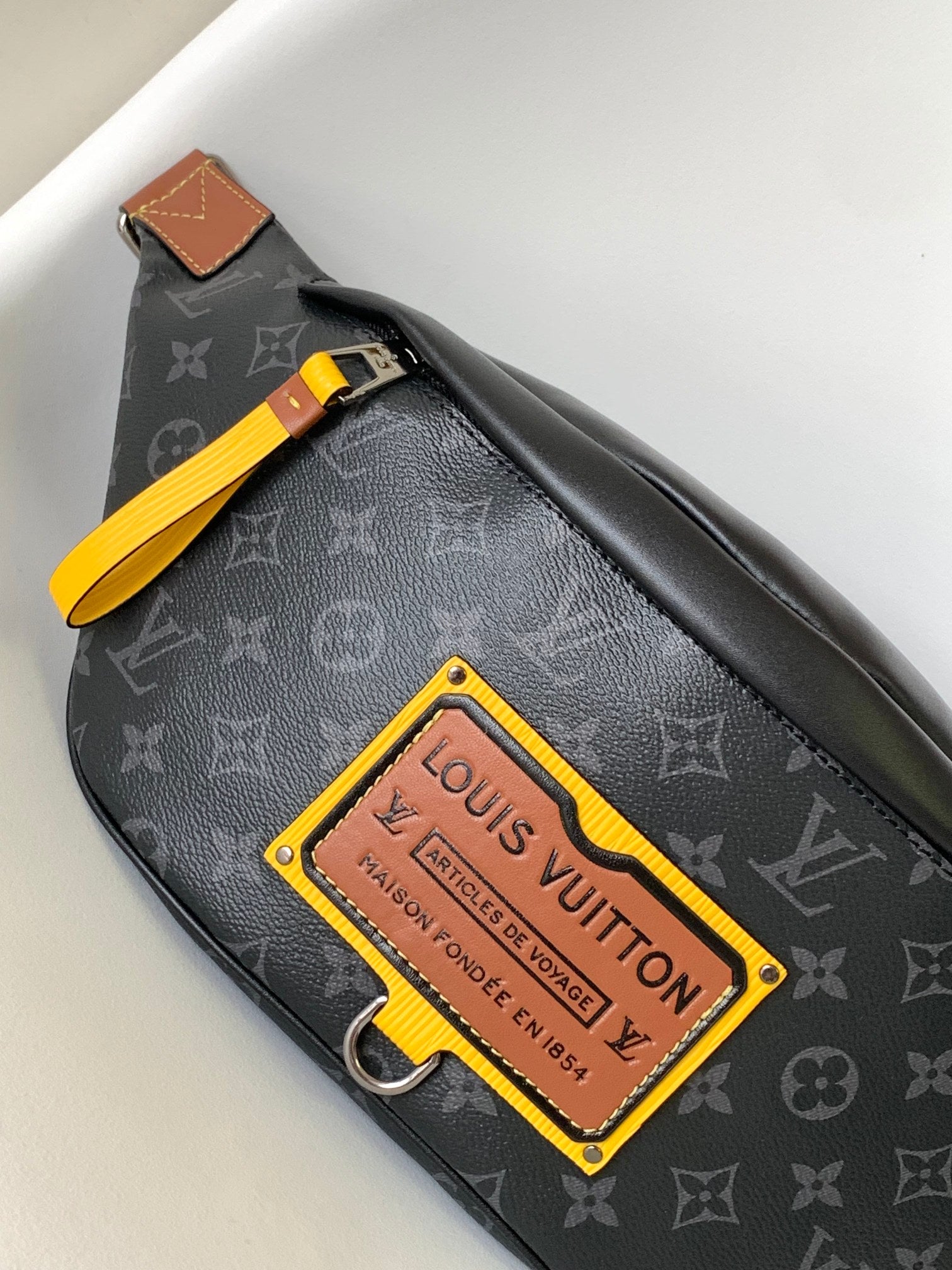 LV 25S BUMBAG 37 IN BLACK AND YELLOW COATED MONOGRAM CALFSKIN