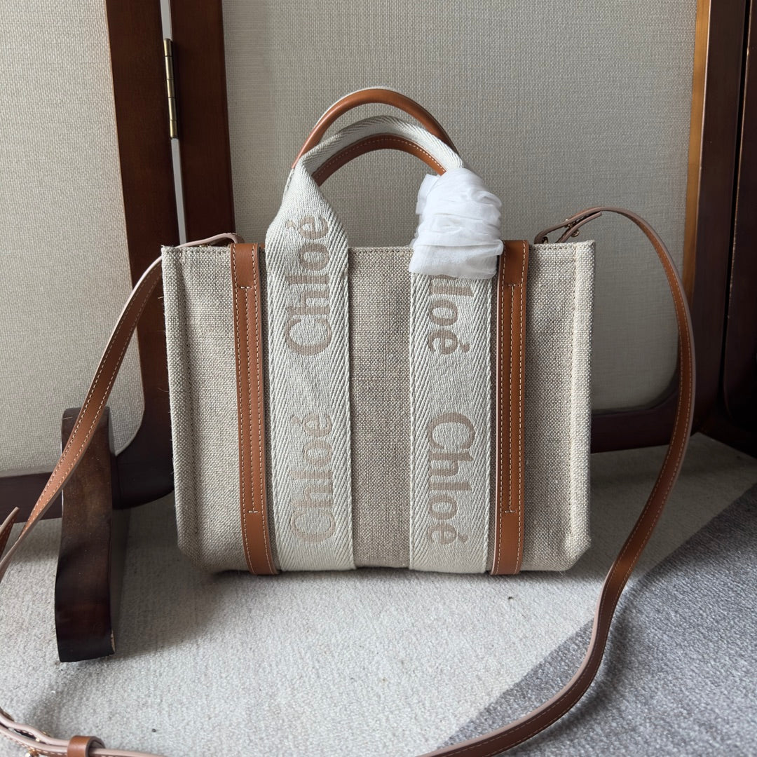SMALL WOODY TOTE BAG 26.5 IN BEIGE LINEN CANVAS WEBBING LOGO EMBROIDERY BROWN CALFSKIN