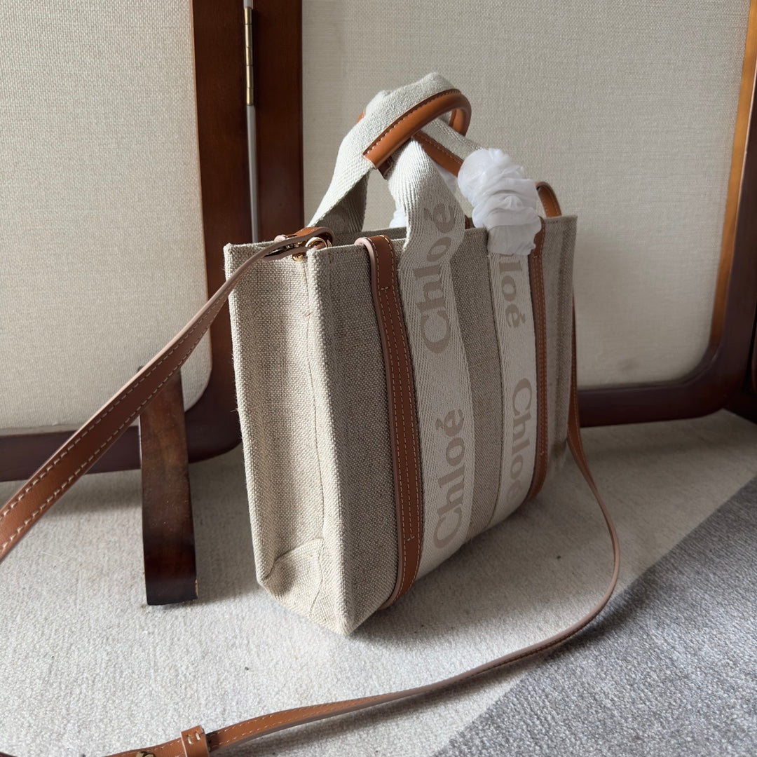 SMALL WOODY TOTE BAG 26.5 IN BEIGE LINEN CANVAS WEBBING LOGO EMBROIDERY BROWN CALFSKIN