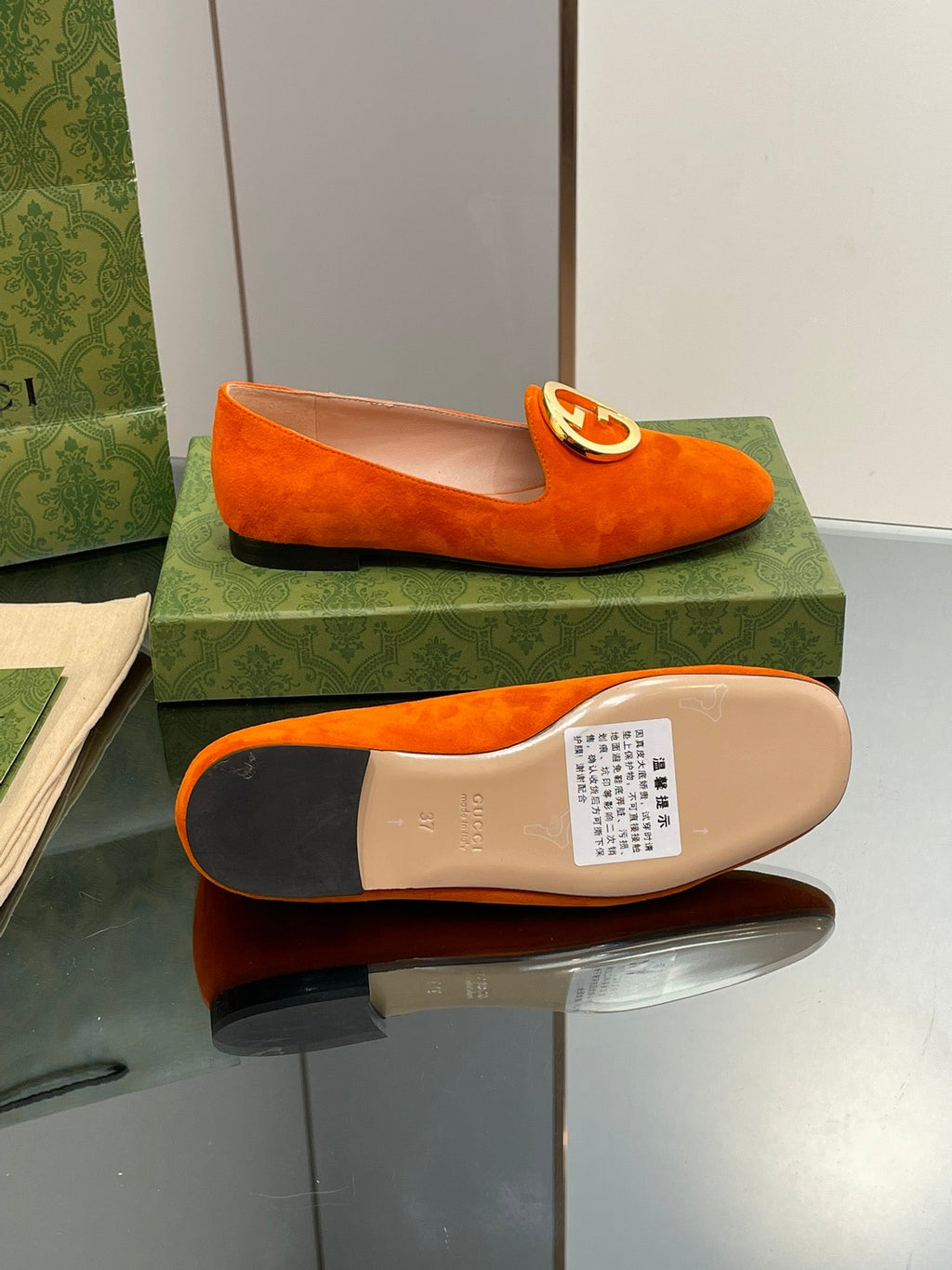 BLONDIE LOGO-PLAQUE LOAFERS IN TIGER ORANGE SUEDE WITH GOLD HARDWARE