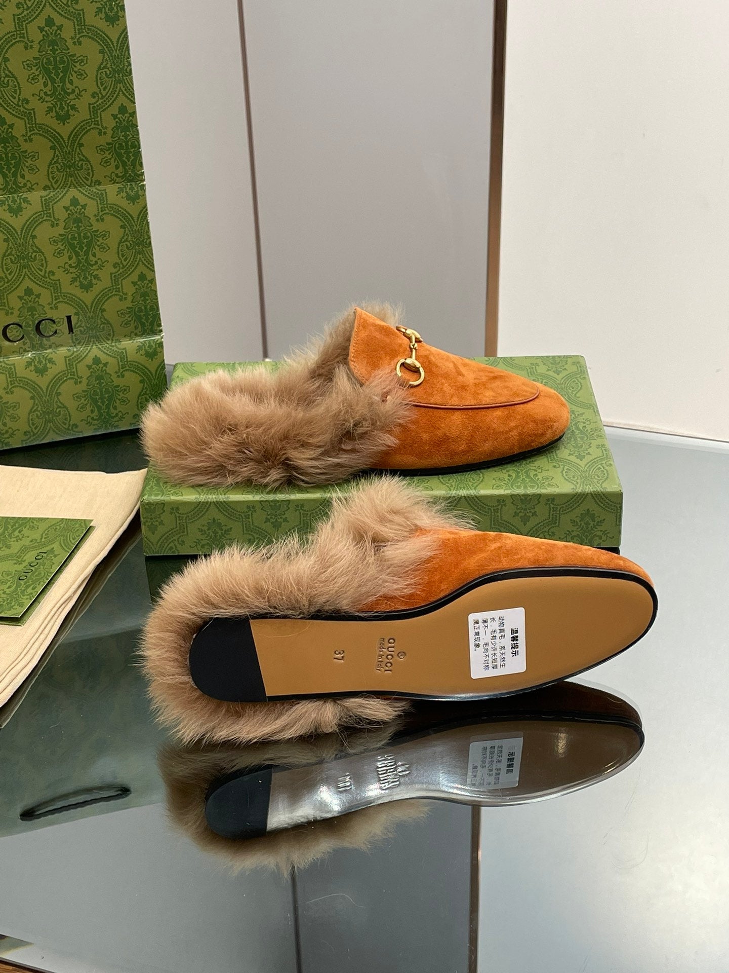HORSEBIT MULE IN BRONZE ORANGE SUEDE AND LAMB WOOL LINING