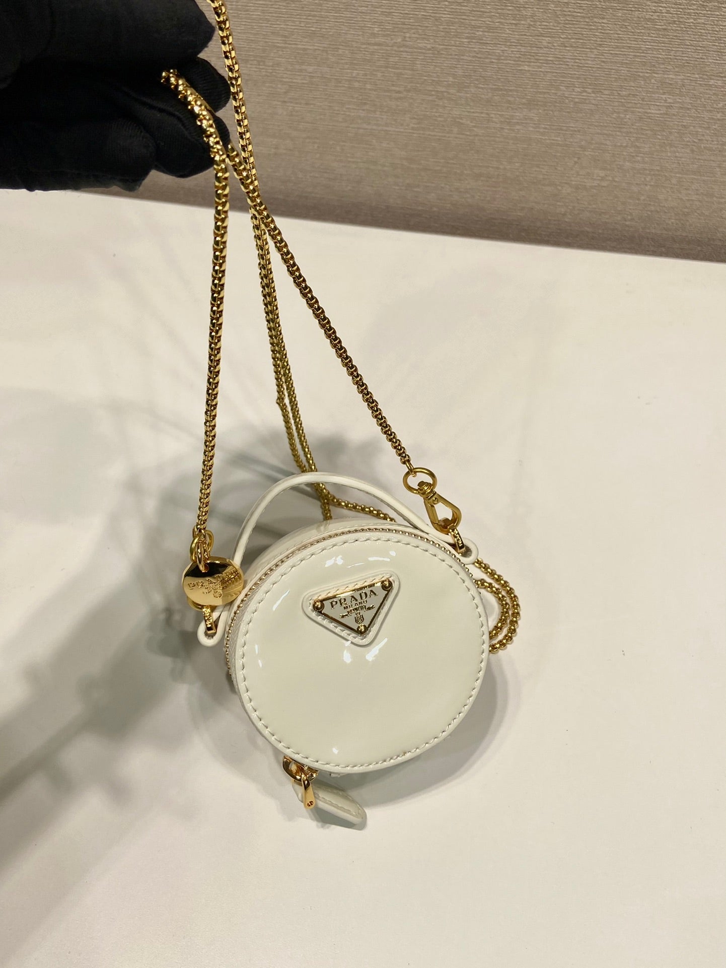 MINI ROUND BAG 8 IN WHITE GLOSSY CALFSKIN GOLD HARDWARE