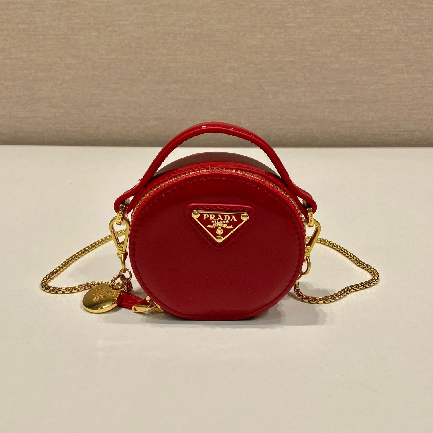 MINI ROUND BAG 8 IN RED GLOSSY CALFSKIN GOLD HARDWARE