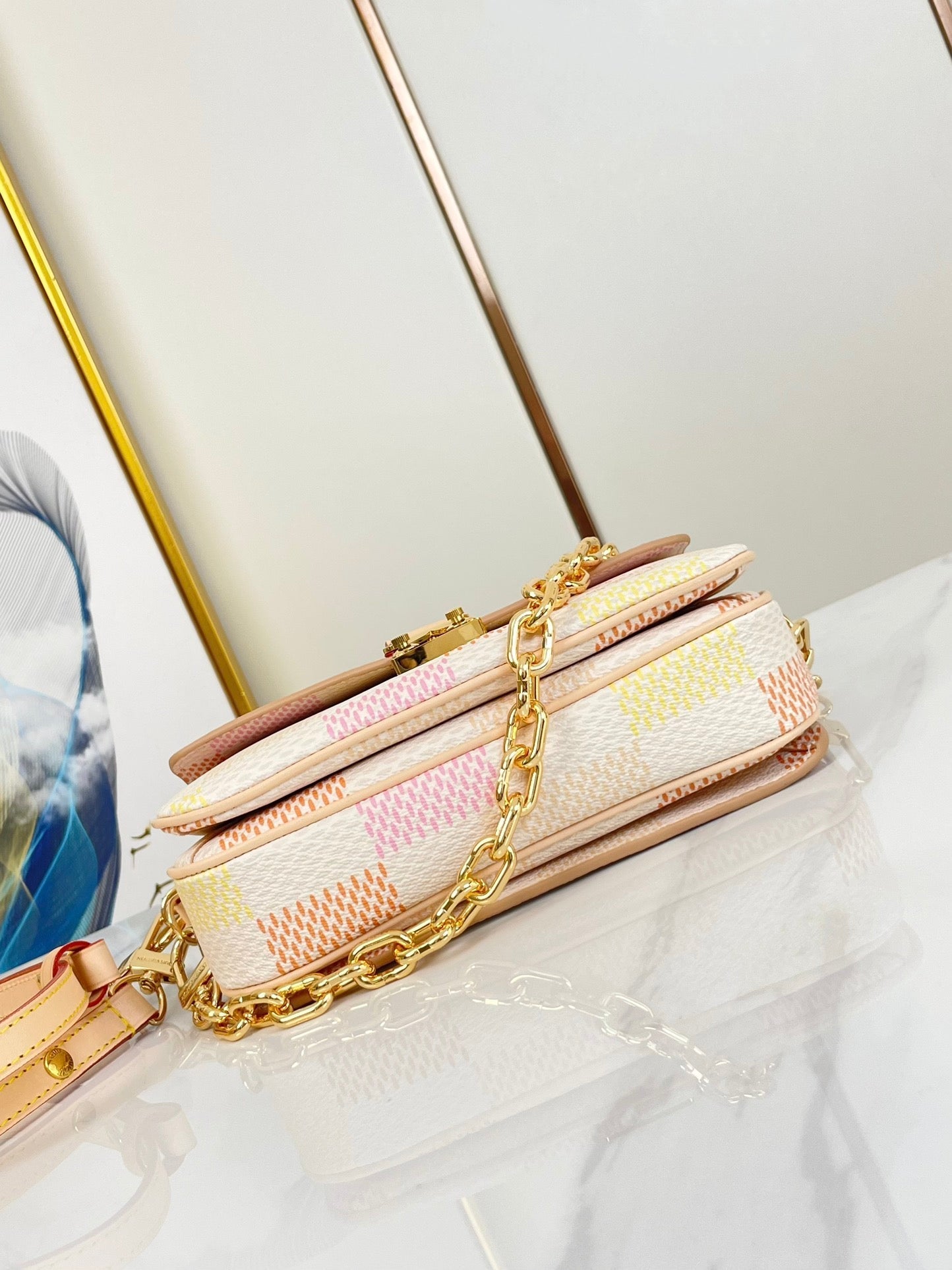 POCHETTE MÉTIS EAST WEST 21 IN PEACH DAMIER GIANT CANVAS GOLD HARDWARE