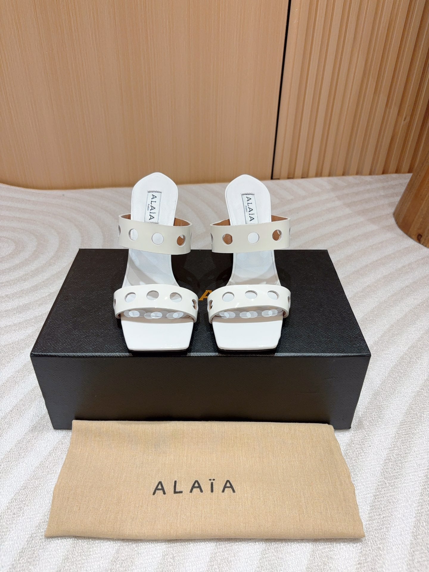 ALAIA TWO-STRAPS HIGH HEEL SANDALS IN WHITE PATENT LAMBSKIN