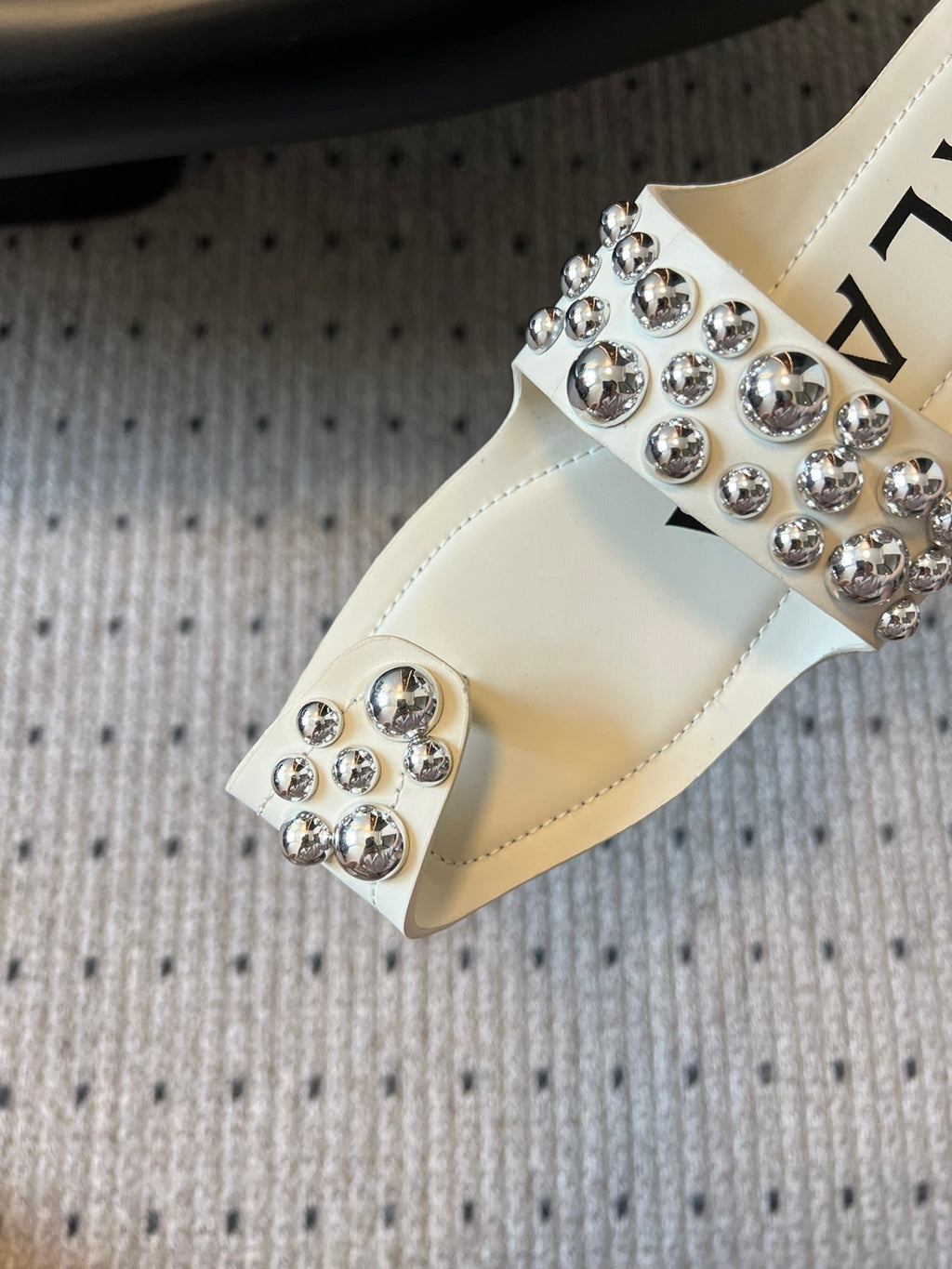 ALAIA FOLDED FLAT MULES WITH SPHERES ON WHITE CALFSKIN