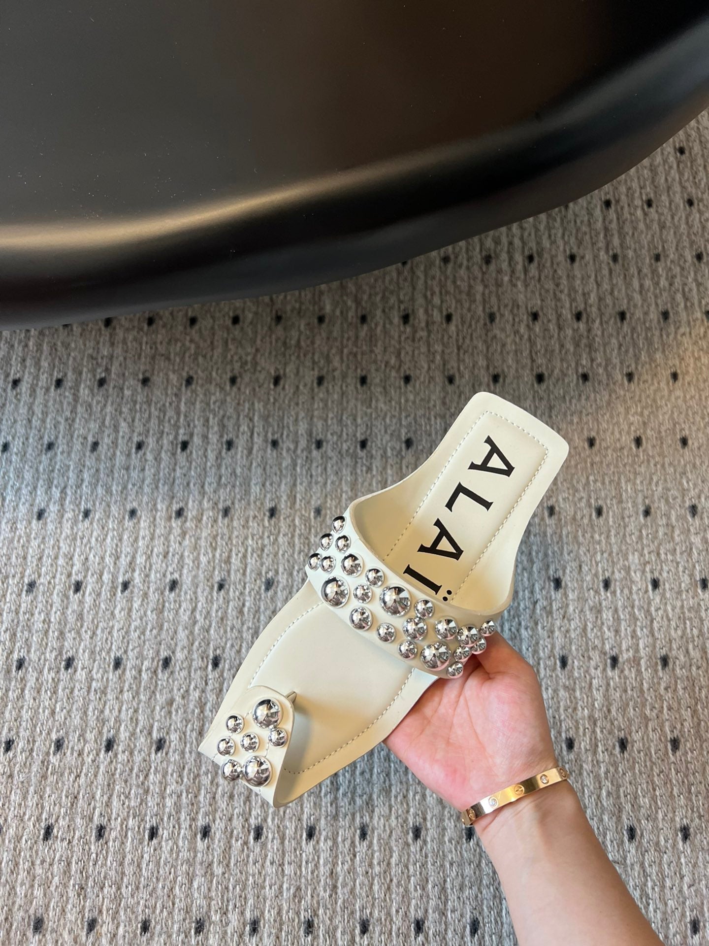 ALAIA FOLDED FLAT MULES WITH SPHERES ON WHITE CALFSKIN