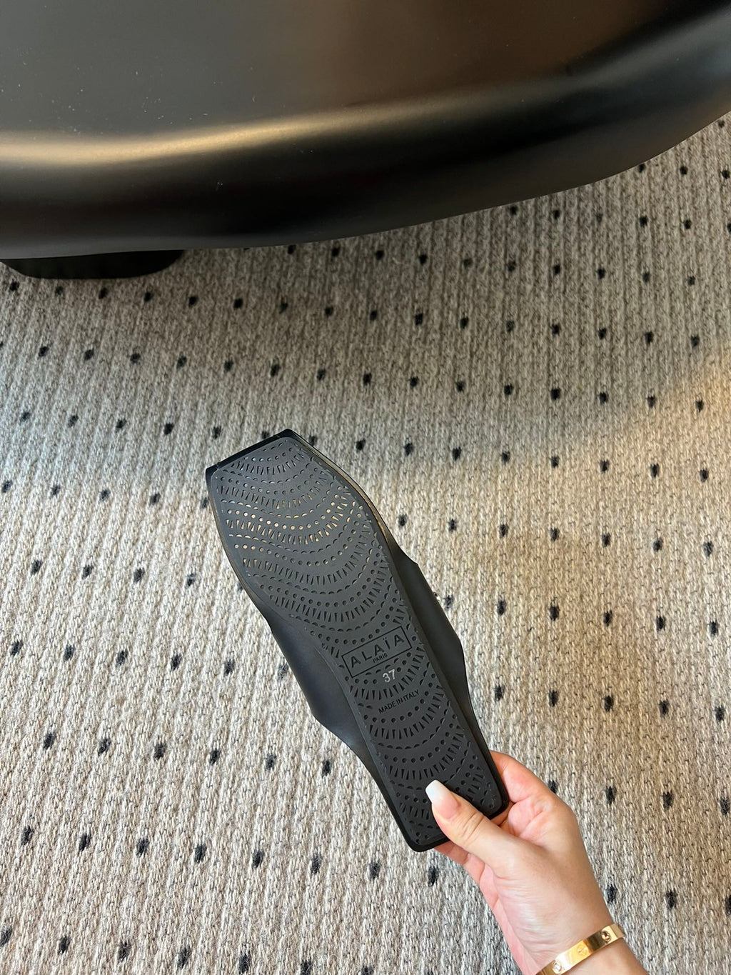 ALAIA FOLDED FLAT MULES WITH SPHERES ON BLACK CALFSKIN