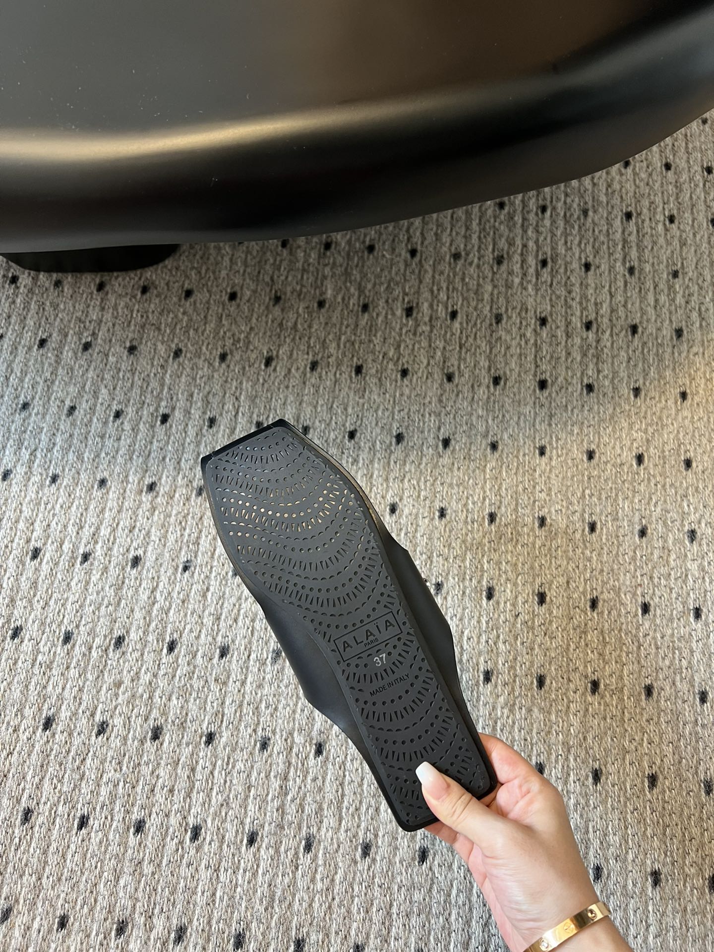 ALAIA FOLDED FLAT MULES WITH SPHERES ON BLACK CALFSKIN