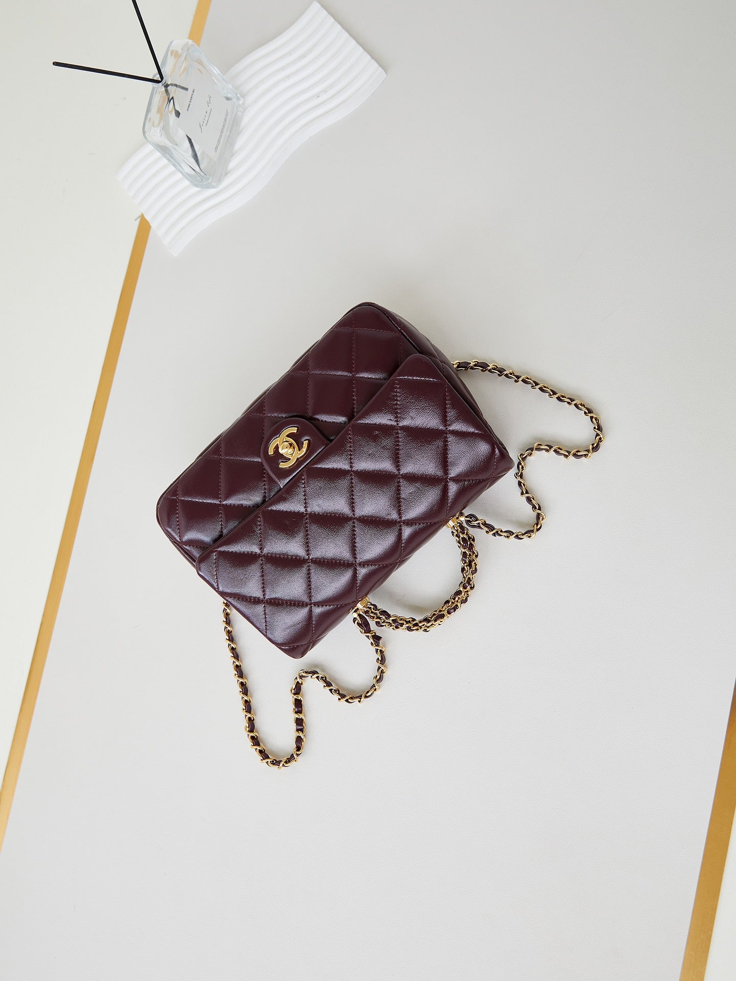 FLAP BAG WITH TOP HANDLE 25 IN WINE RED OIL-WAX LAMBSKIN GOLD HARDWARE