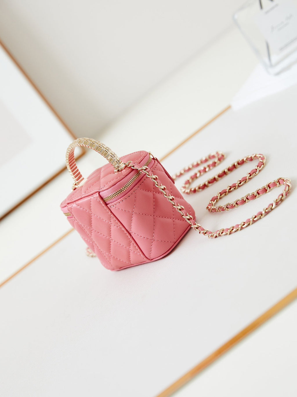 CHANEL 25S MINI VANITY BAG 11 CM IN PEACH PINK LAMBSKIN WITH CRYSTAL-EMBELLISHED CC LOGO