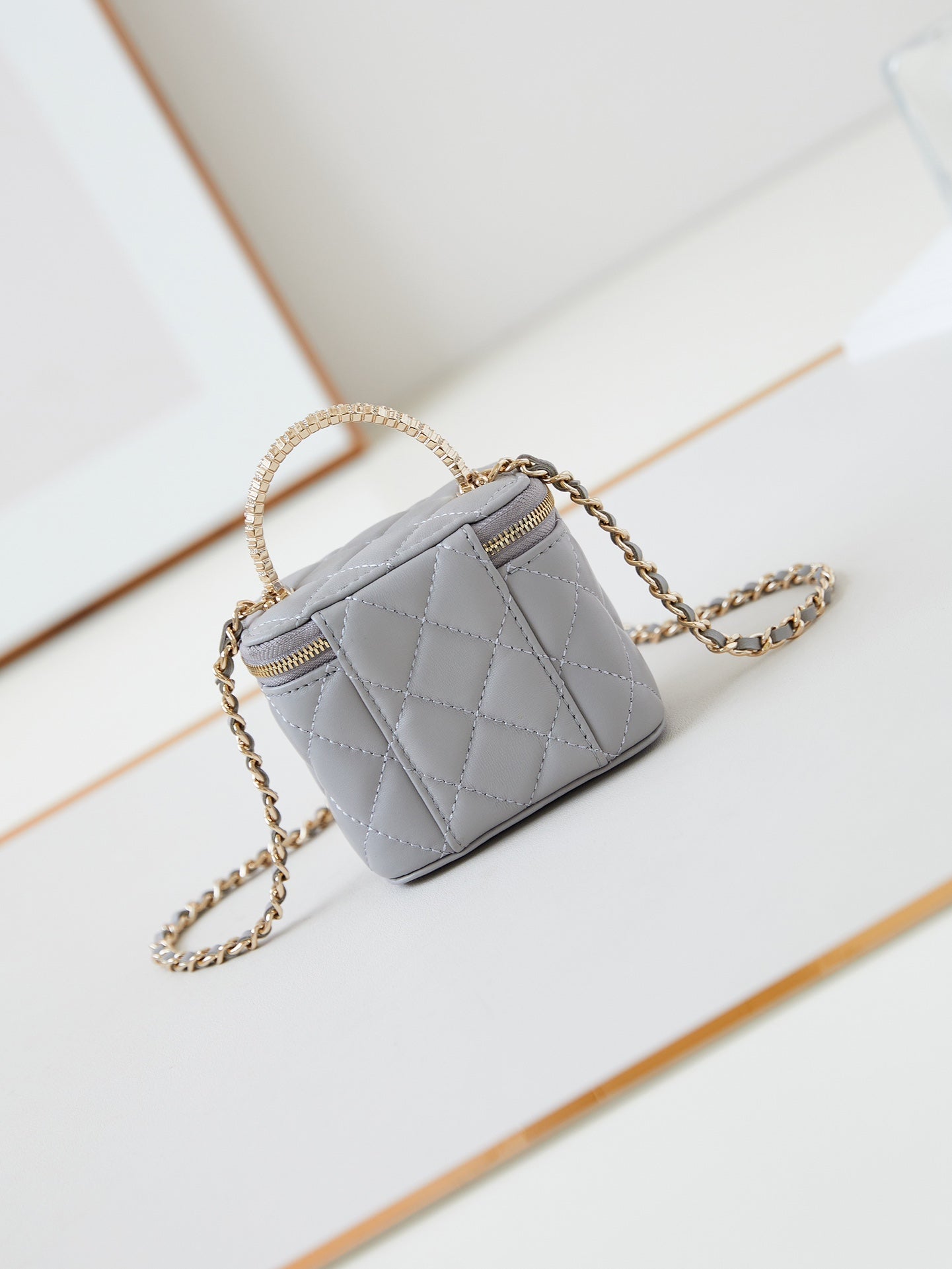 CHANEL 25S MINI VANITY BAG 11 CM IN GREY LAMBSKIN WITH CRYSTAL-EMBELLISHED CC LOGO