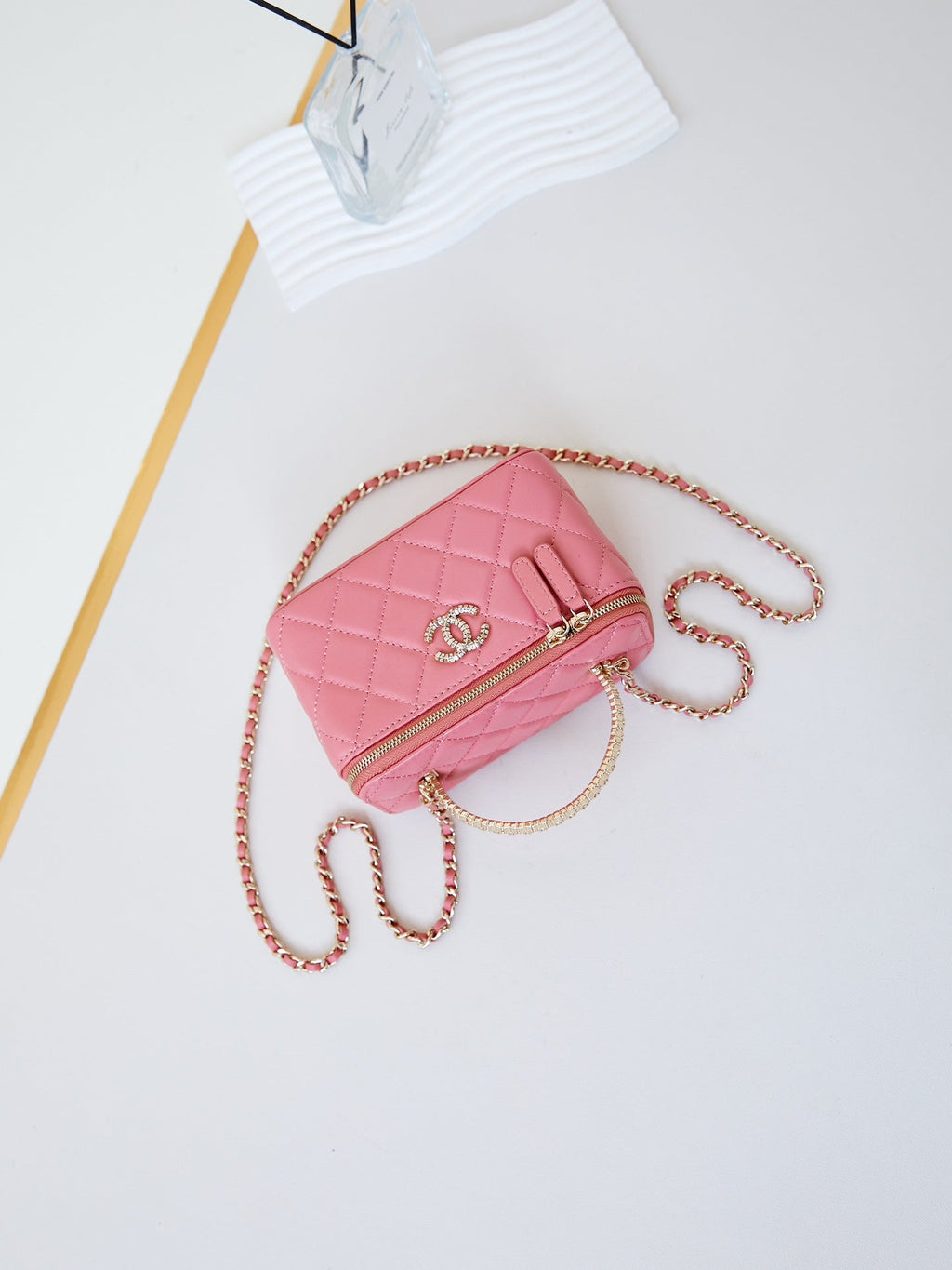 CHANEL 25S MINI VANITY BAG 16 CM IN PEACHY PINK LAMBSKIN WITH CRYSTAL-EMBELLISHED CC LOGO