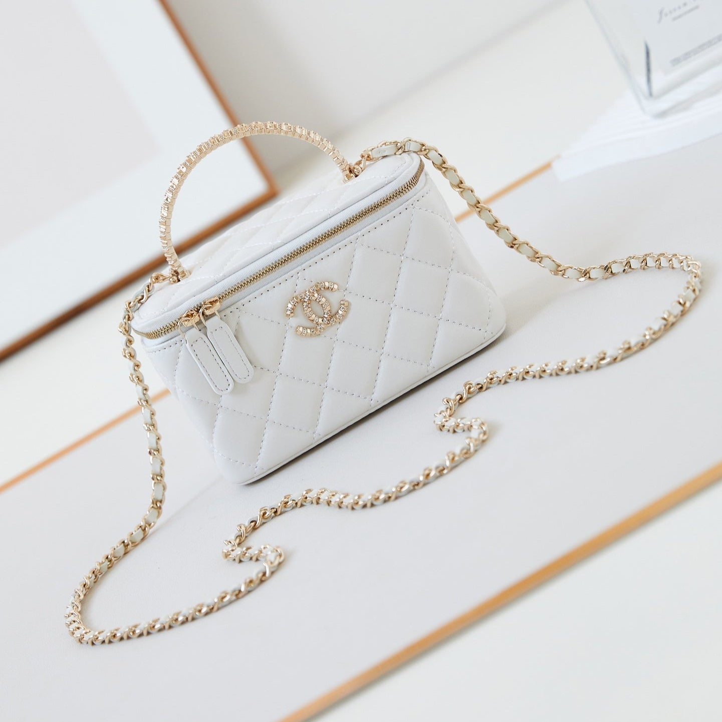 CHANEL 25S MINI VANITY BAG 16 CM IN WHITE LAMBSKIN WITH CRYSTAL-EMBELLISHED CC LOGO