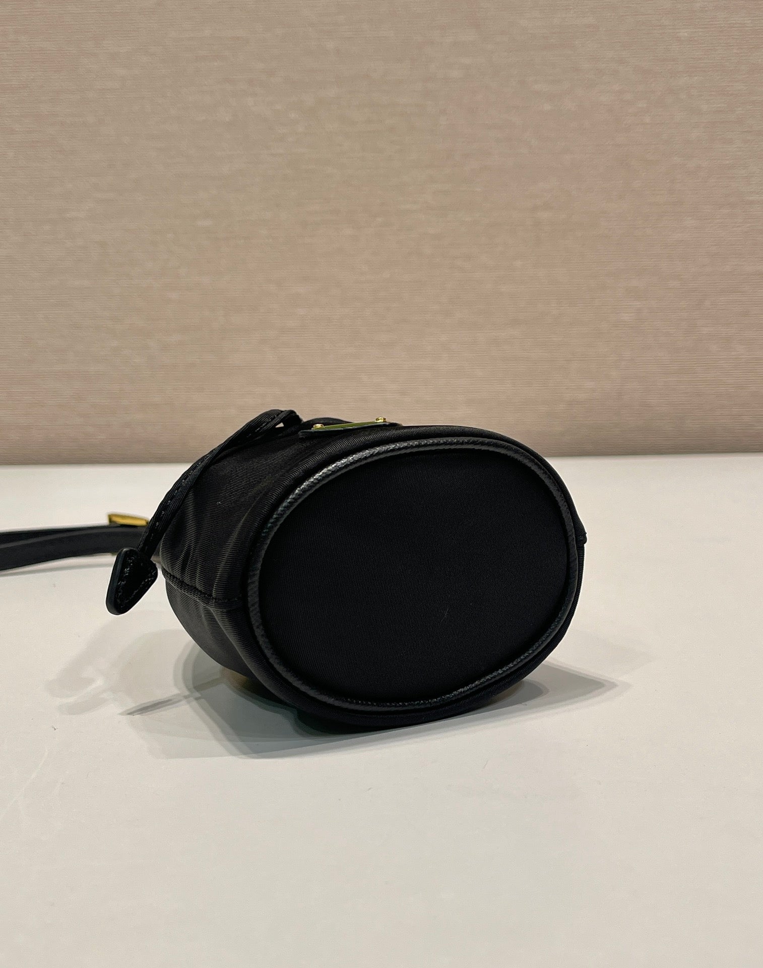 MINI BUCKET BAG 10 IN BLACK RE-NYLON AND SAFFIANO LEATHER STRAP