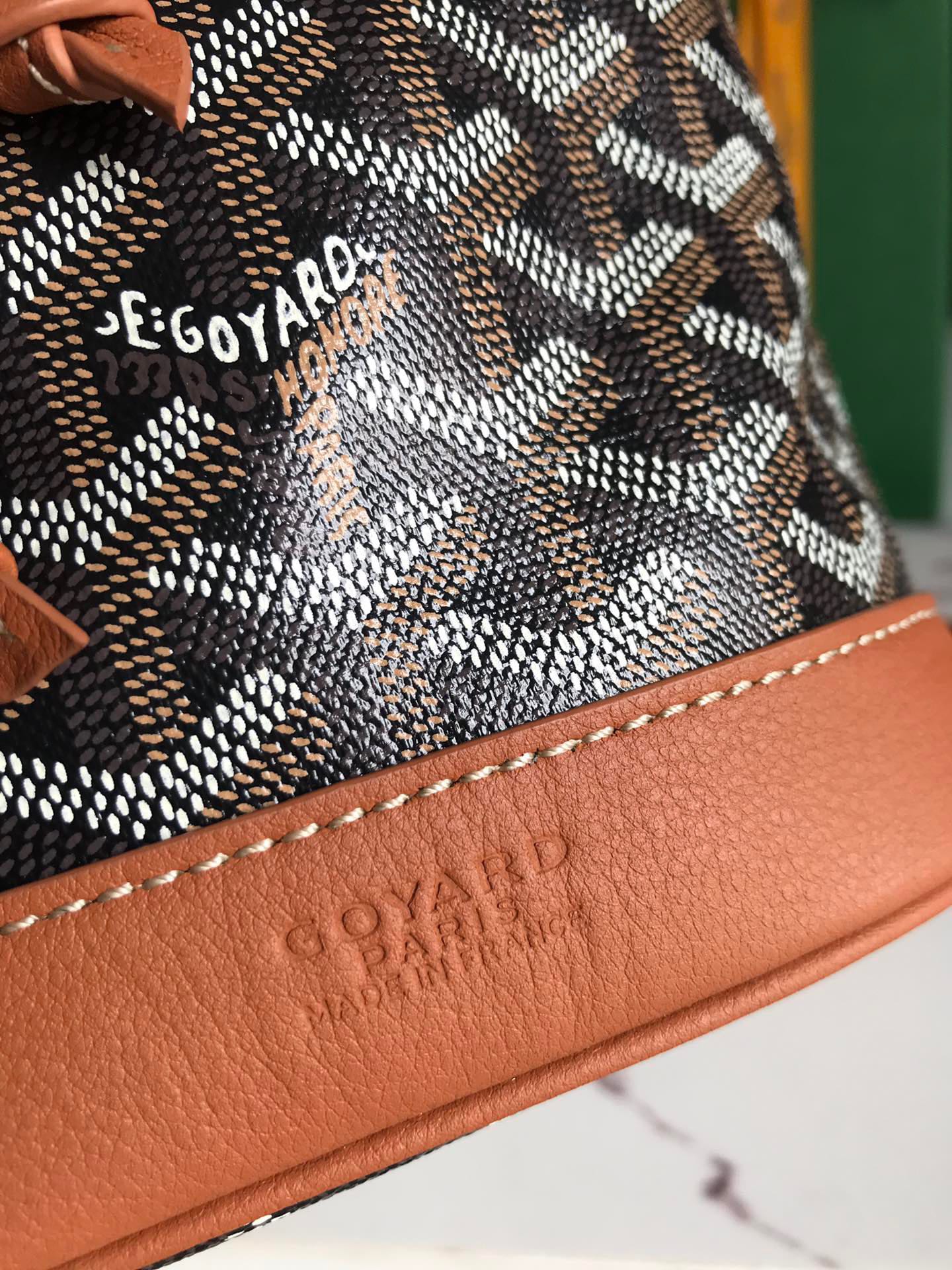 PETIT FLOT BUCKET BAG 22 IN BLACK GOYARDINE CANVAS AND TAN LAMBSKIN TRIM