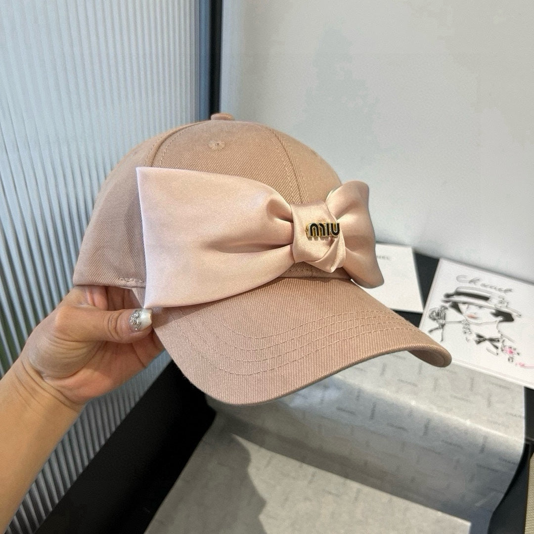 MM BASEBALL CAP IN BEIGE FABRIC WITH LARGE PINK BOW