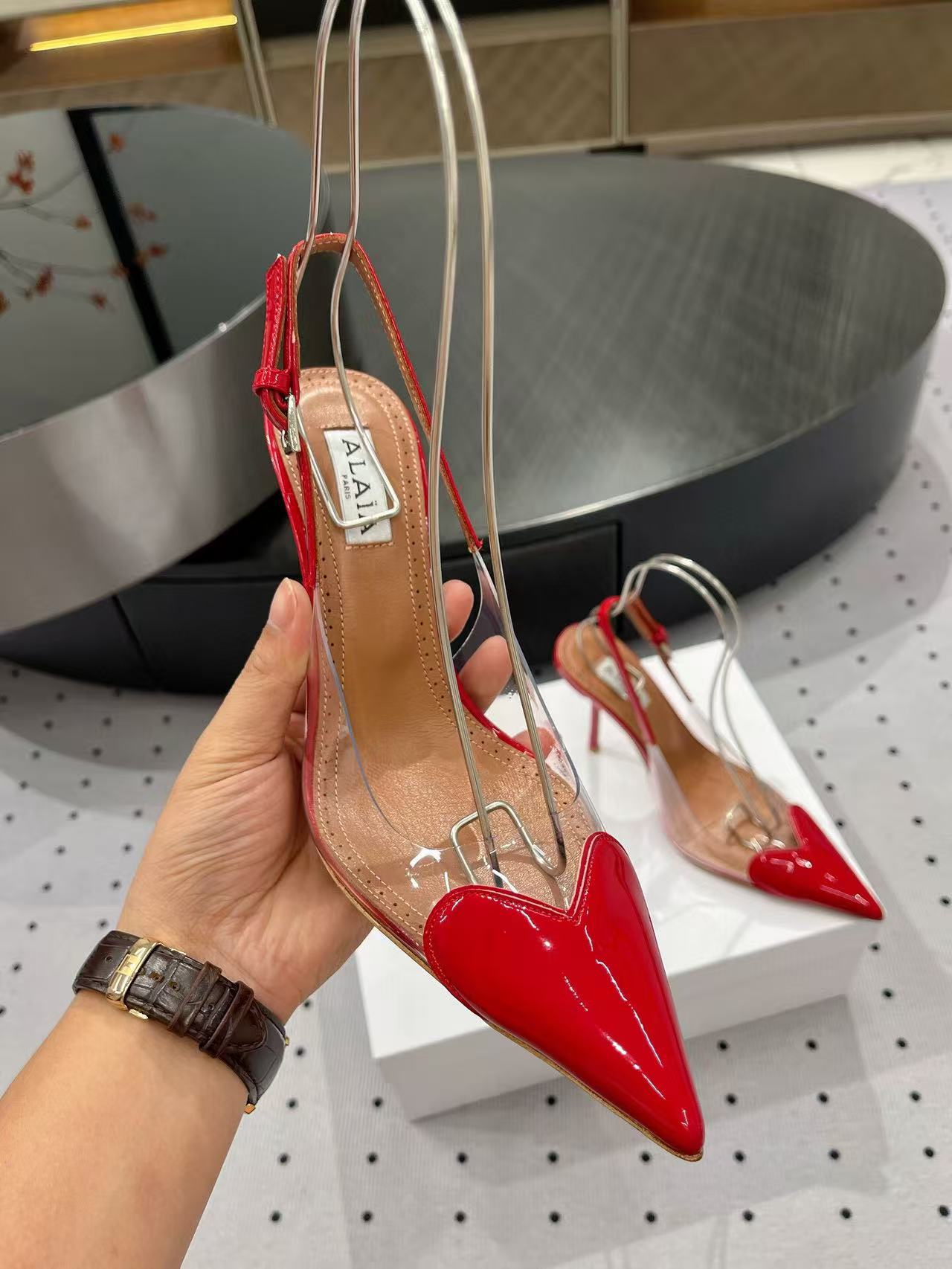 ALAIA HIGH 9 CM SLINGBACK IN CHERRY RED PATENT CALFSKIN AND FILM