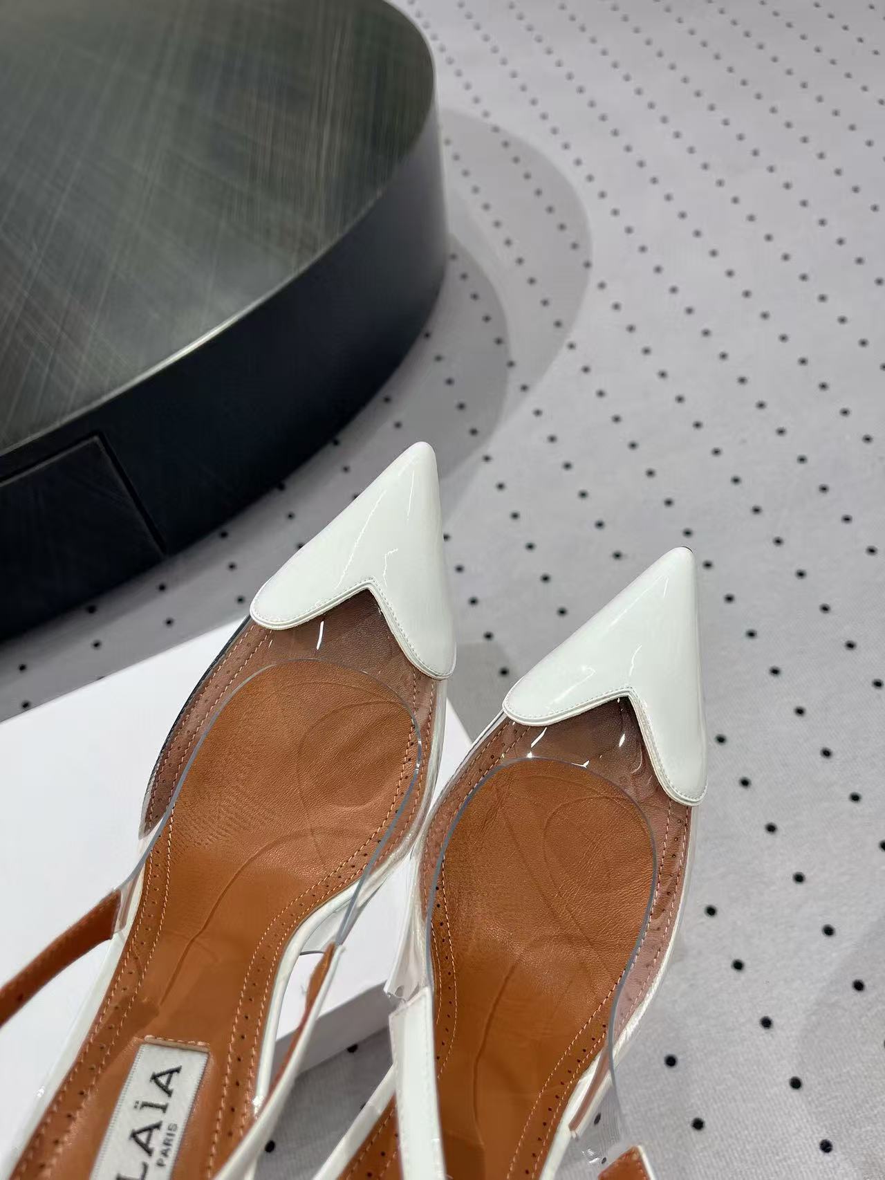 ALAIA HIGH 9 CM SLINGBACK IN WHITE PATENT CALFSKIN AND FILM