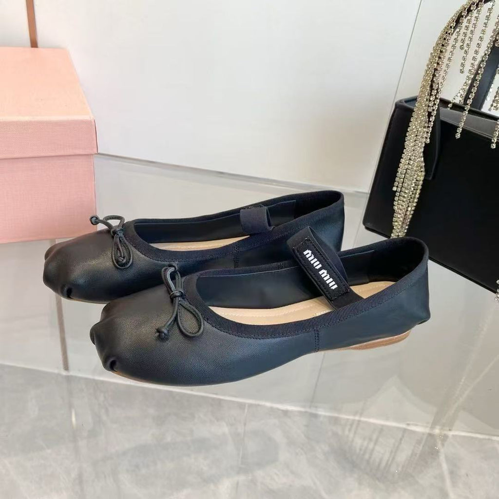 MM BOW BALLET FLATS IN BLACK CALFSKIN