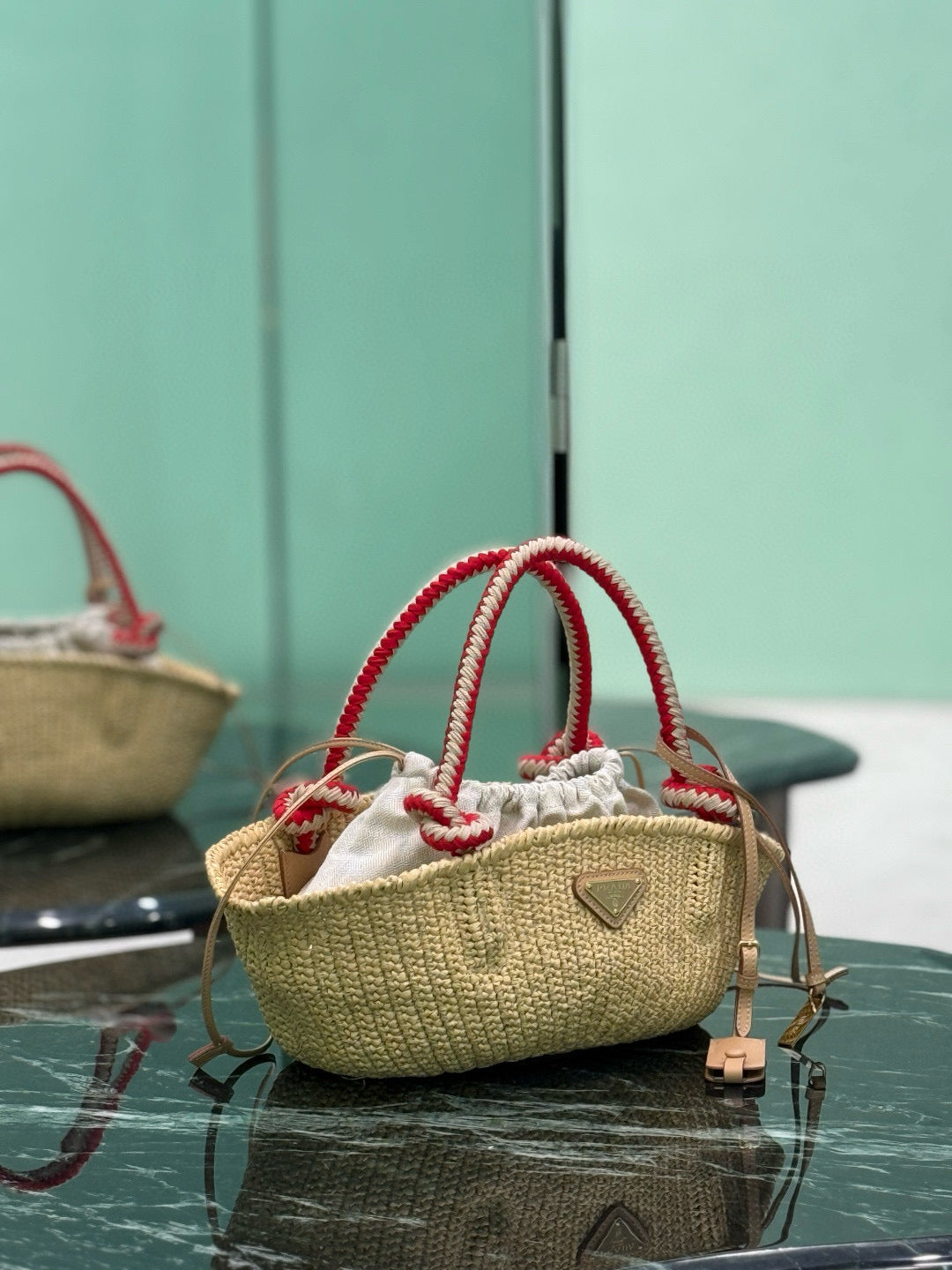 PRA HANDBAG 26 IN BEIGE RAFFIA AND RED WOVEN HANDLES
