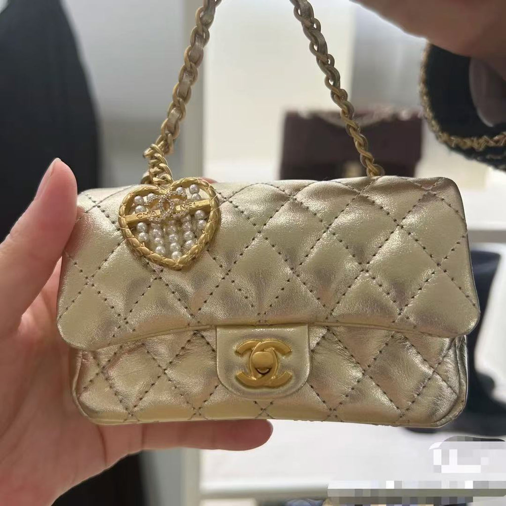 CC CLASSIC FLAP BAG 13 IN GOLD LAMBSKIN WITH PEARL HEART CHARM