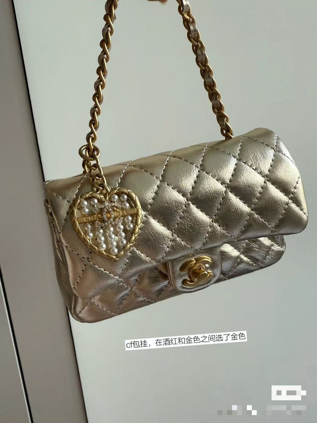 CC CLASSIC FLAP BAG 13 IN GOLD LAMBSKIN WITH PEARL HEART CHARM