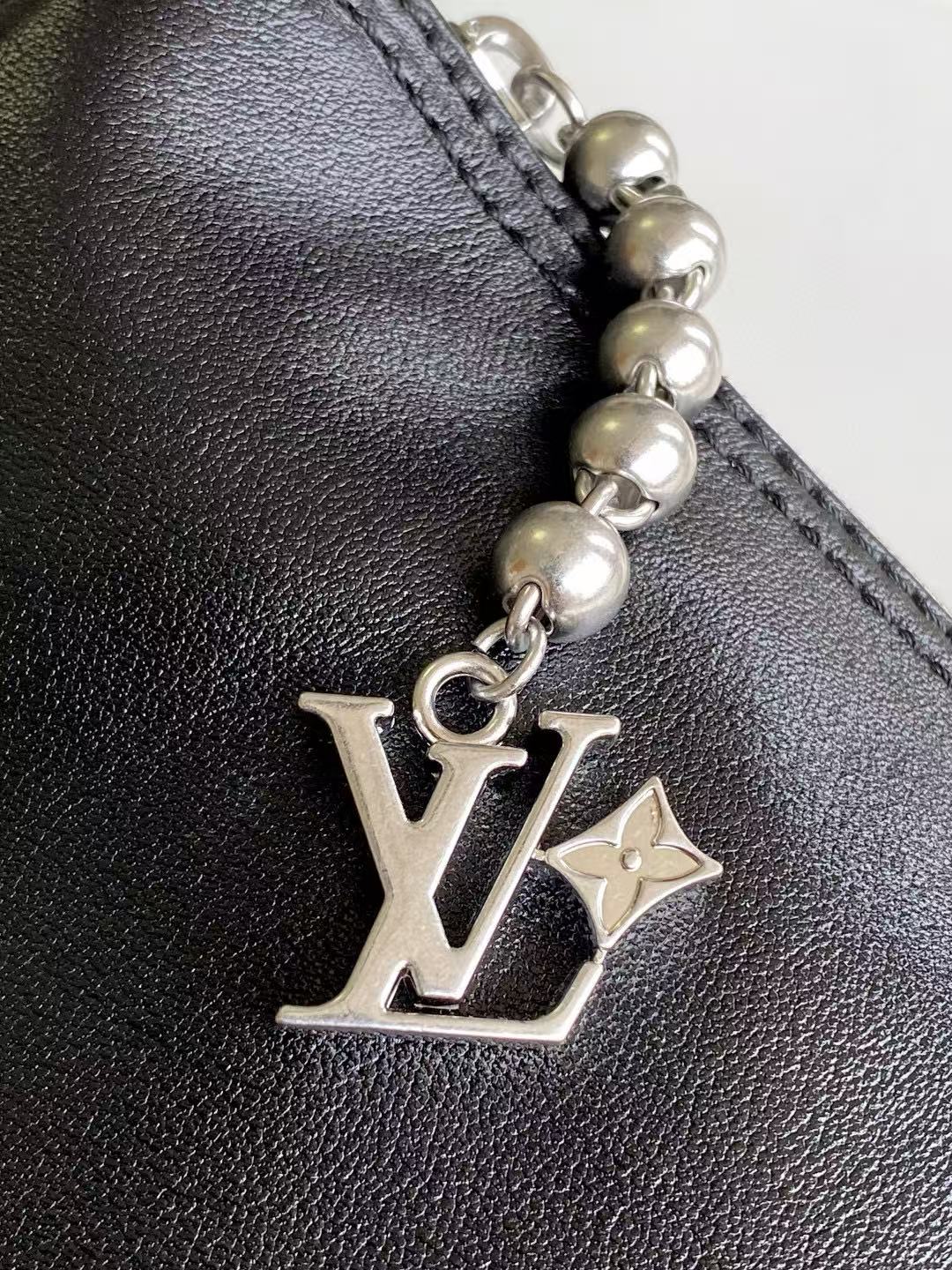 LV SHOULDER BAG 48 IN BLACK CALFSKIN EMBOSSED STRAP