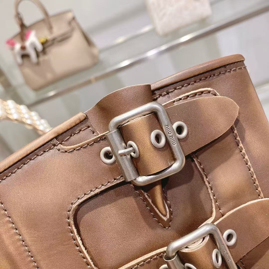 THICK-SOLED BUCKLE BOOTS IN BRORN CALFSKIN