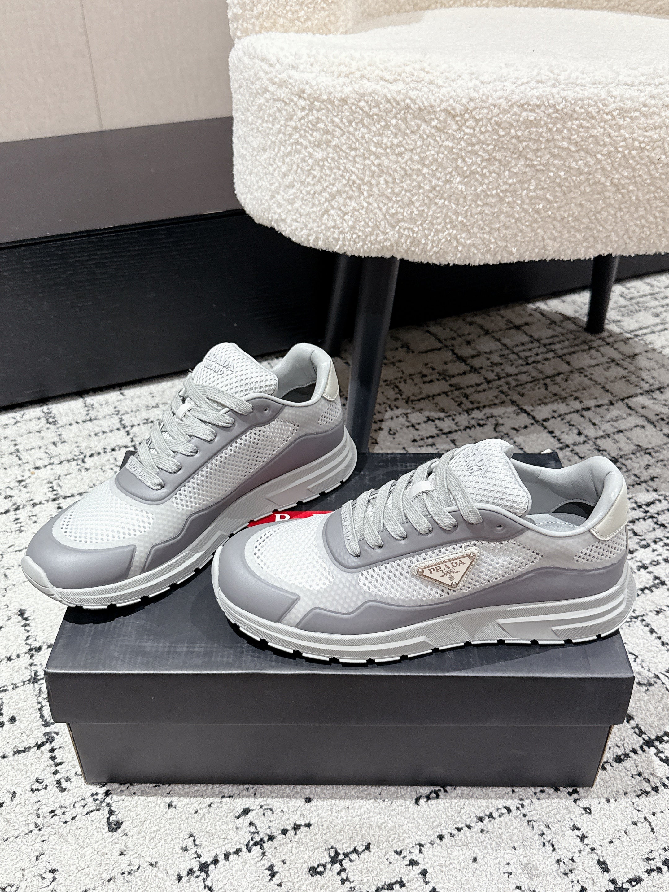 PRADA 25S MEN SNEAKERS IN GRAY AND WHITE CANVAS